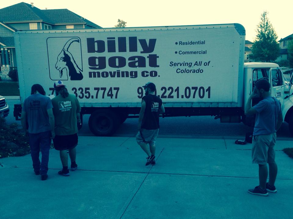 Fort Collins movers loading furniture into a truck during a residential move