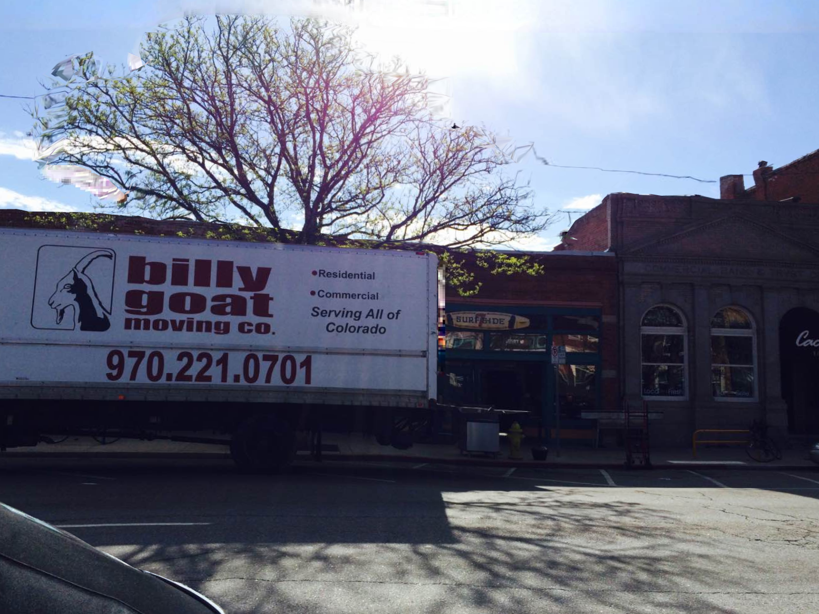 Moving crew carrying furniture in Fort Collins