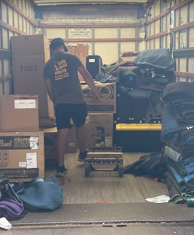 Fort Collins movers wrapping and protecting furniture before loading during a residential move
