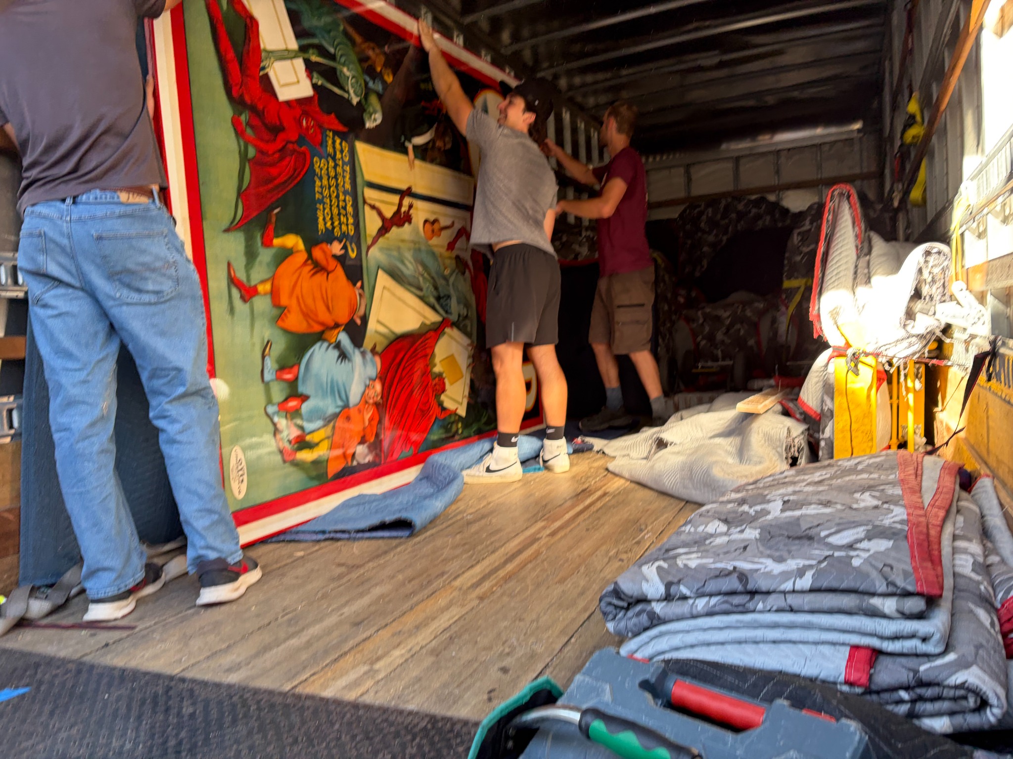 Billy Goat Moving crew carrying oversized artwork during a residential move in Fossil Creek, Fort Collins Colorado