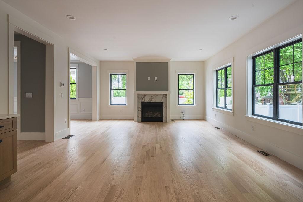 Living room cleared of furniture for hardwood floor installation and refinishing.