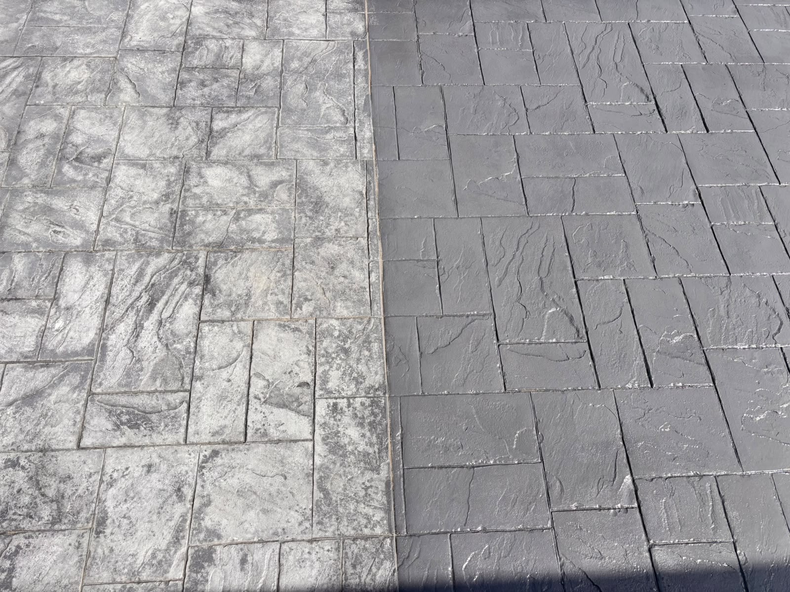 Partially restored driveway showing treated and untreated sections.