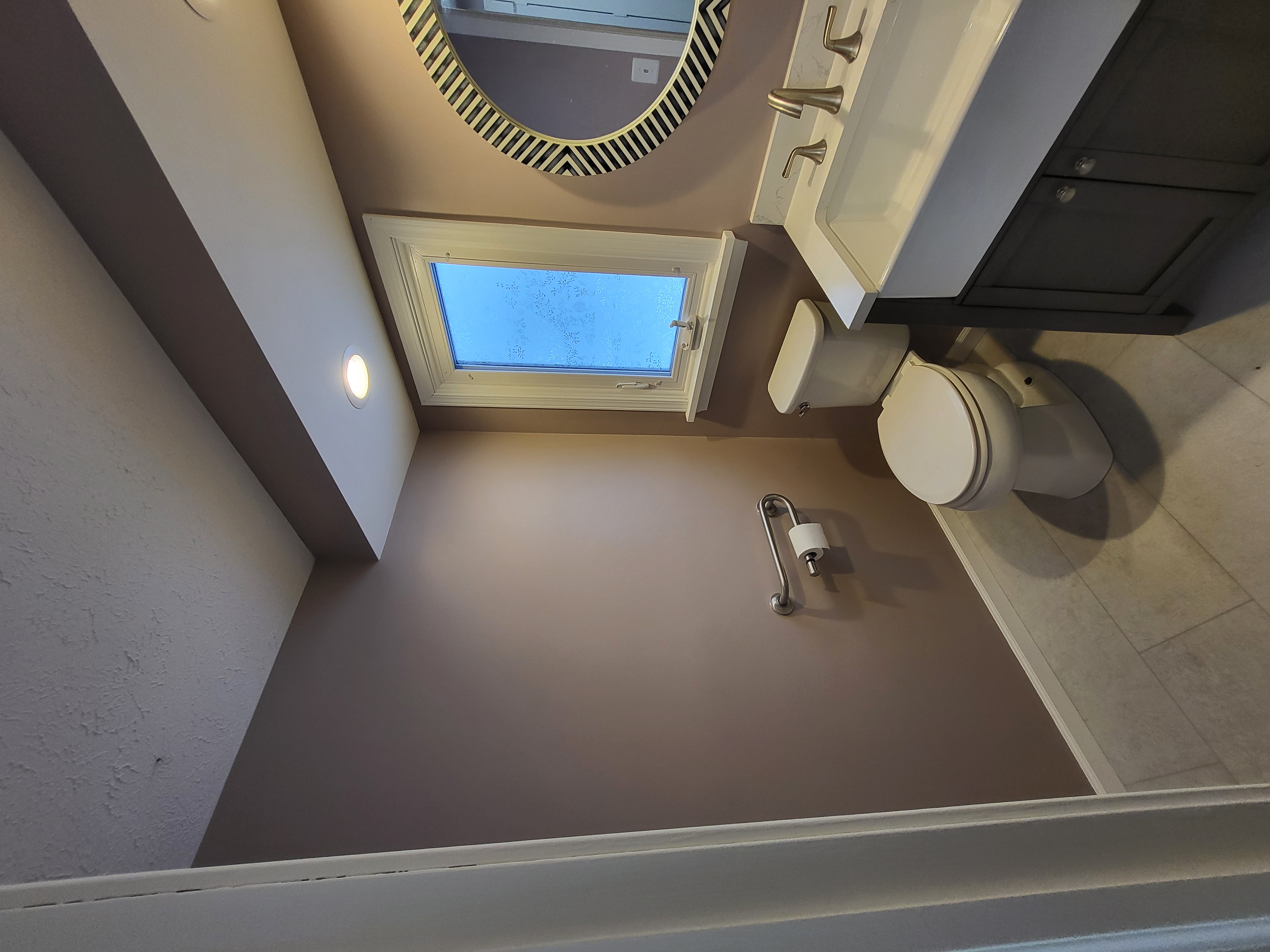 Bathroom after painting in a warm mauve color