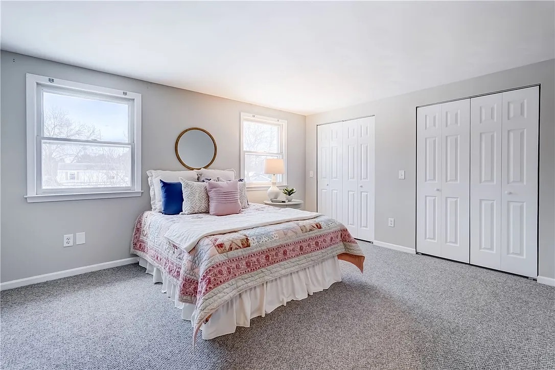 Bright bedroom freshly painted in light gray