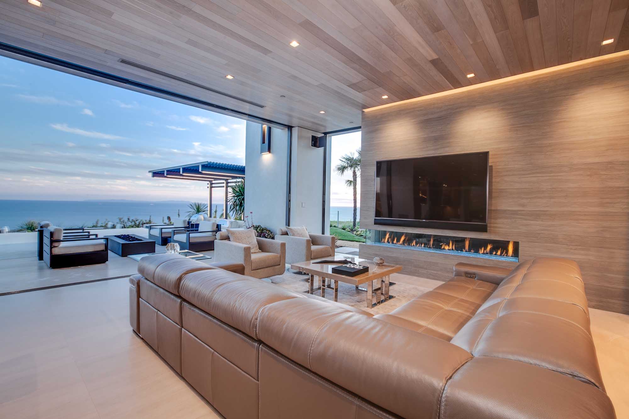 Open Concept Living Room with Floor to Ceiling Glass and Panoramic Ocean Views