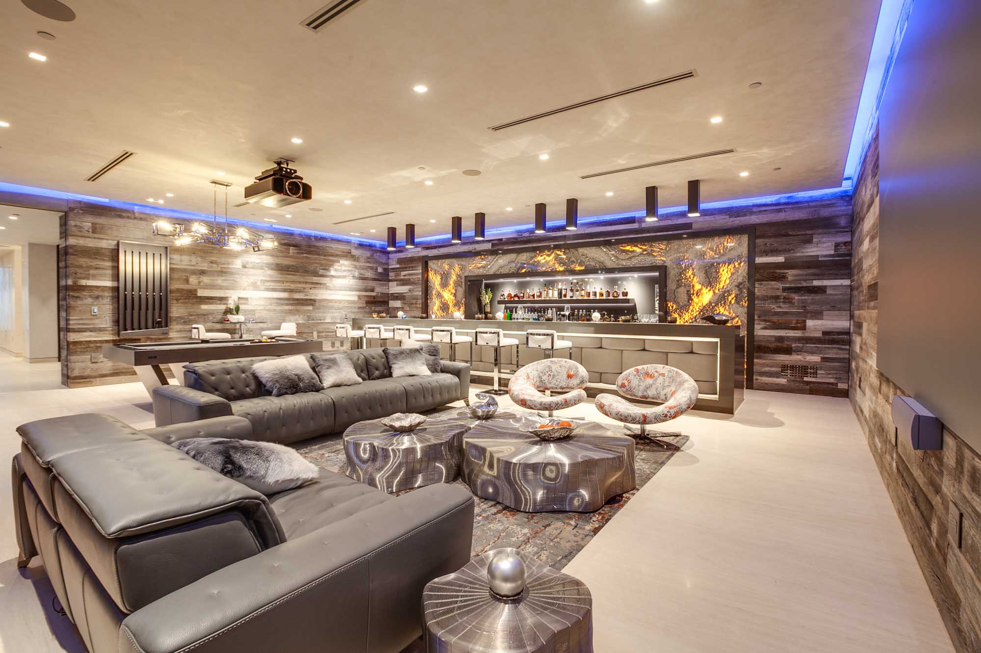 Modern Open Concept Dining and Living Area with Floor to Ceiling Glass and Unobstructed Ocean Views