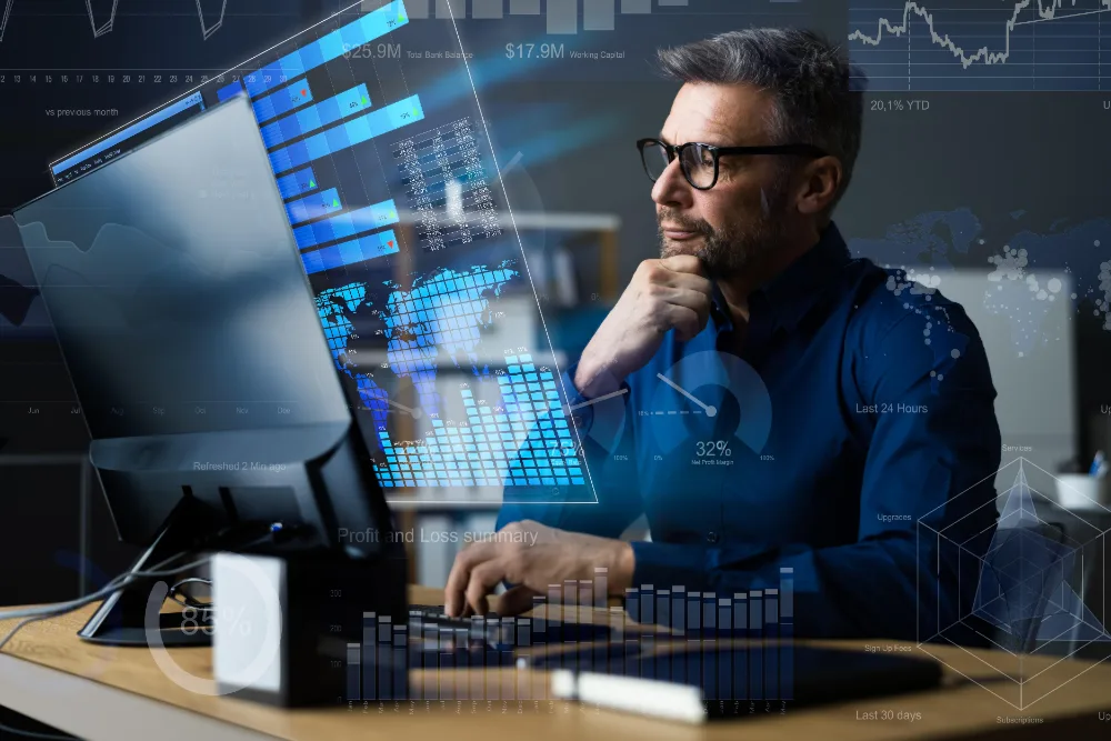 Directivo analizando tableros de datos e IA durante un programa de capacitación en tecnología