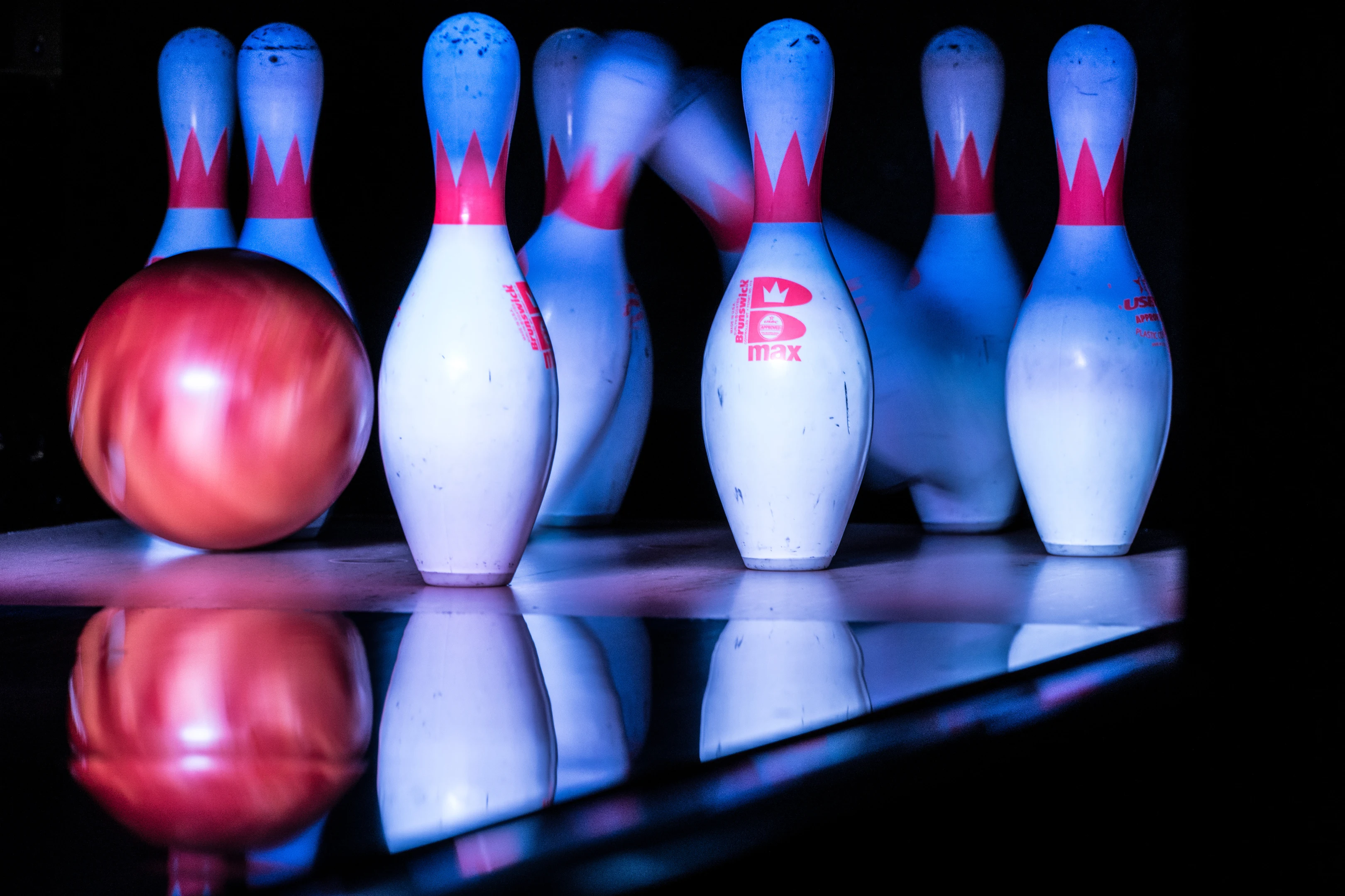 Bowling pins and a red ball at Kykko Bowling