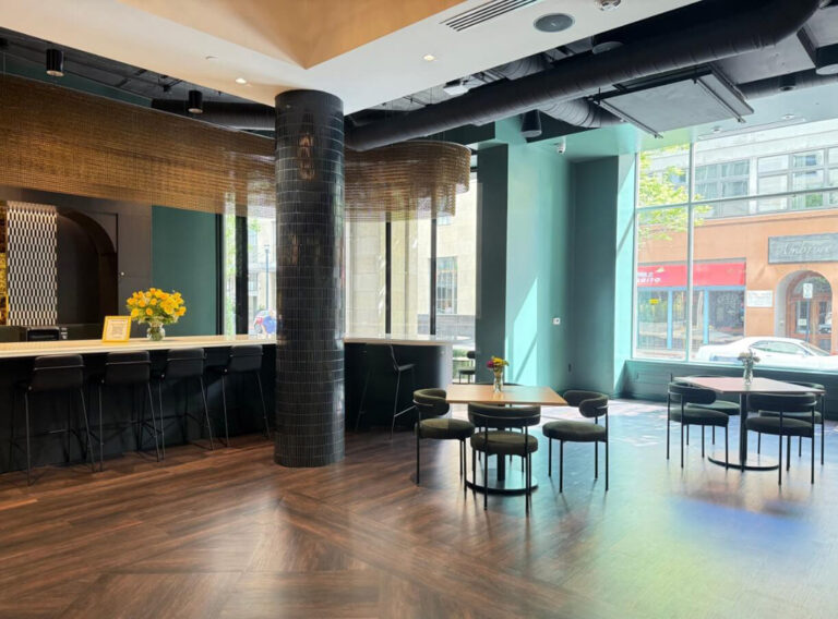 Café bar and lounge seating with downtown views