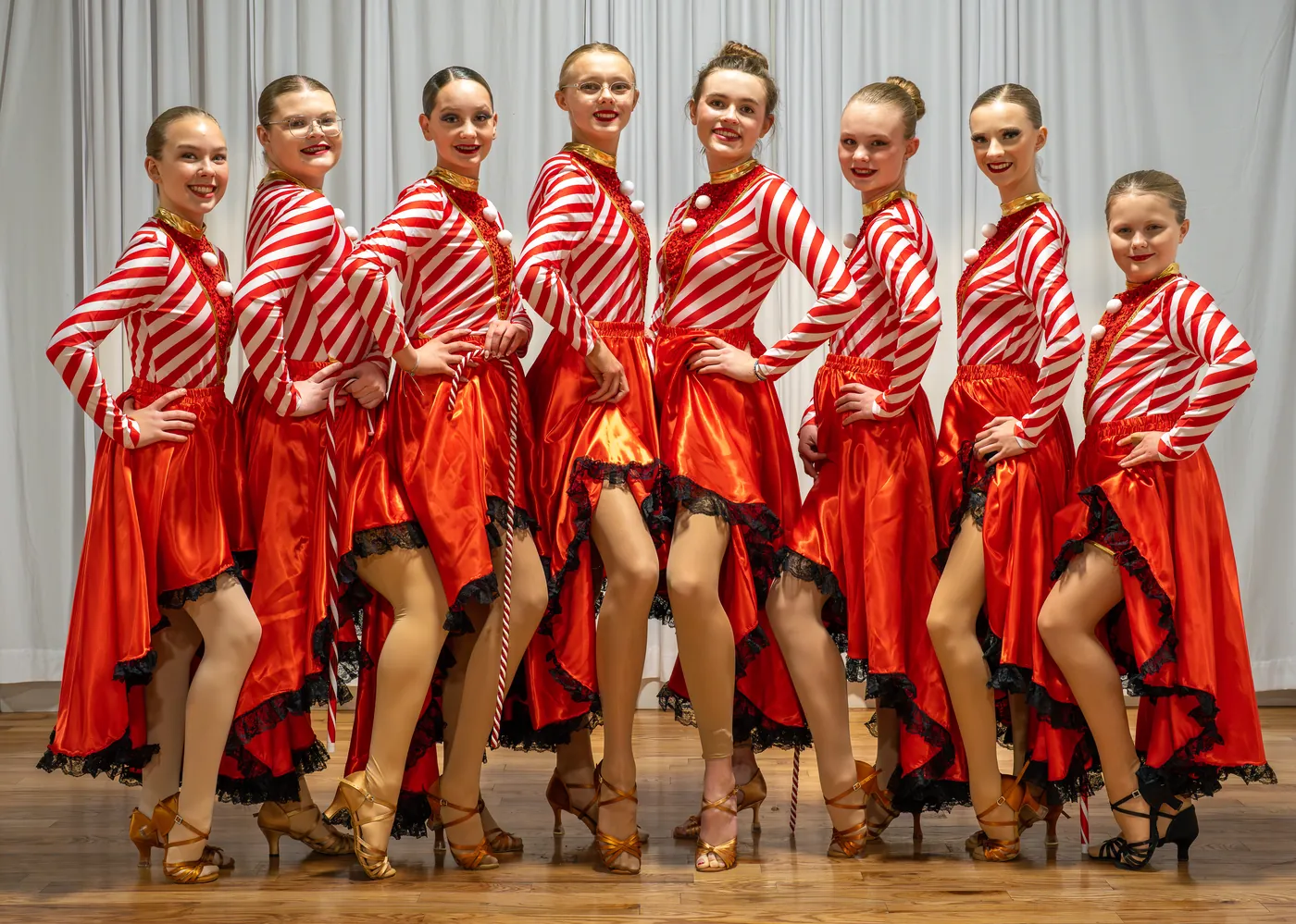 Ladu ballroom dancers in red Latin costumes