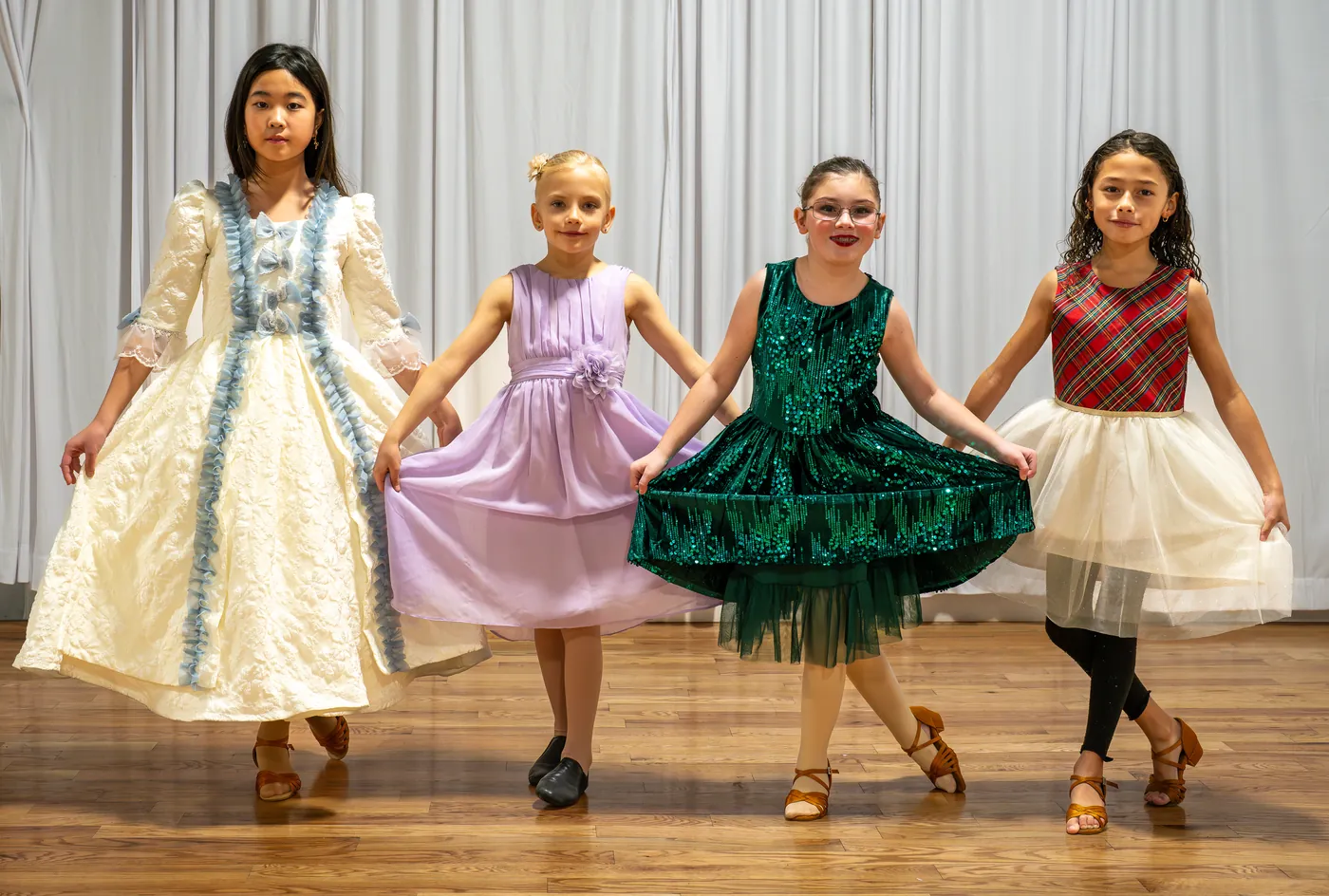 Ladu students in showcase costumes and ballroom shoes