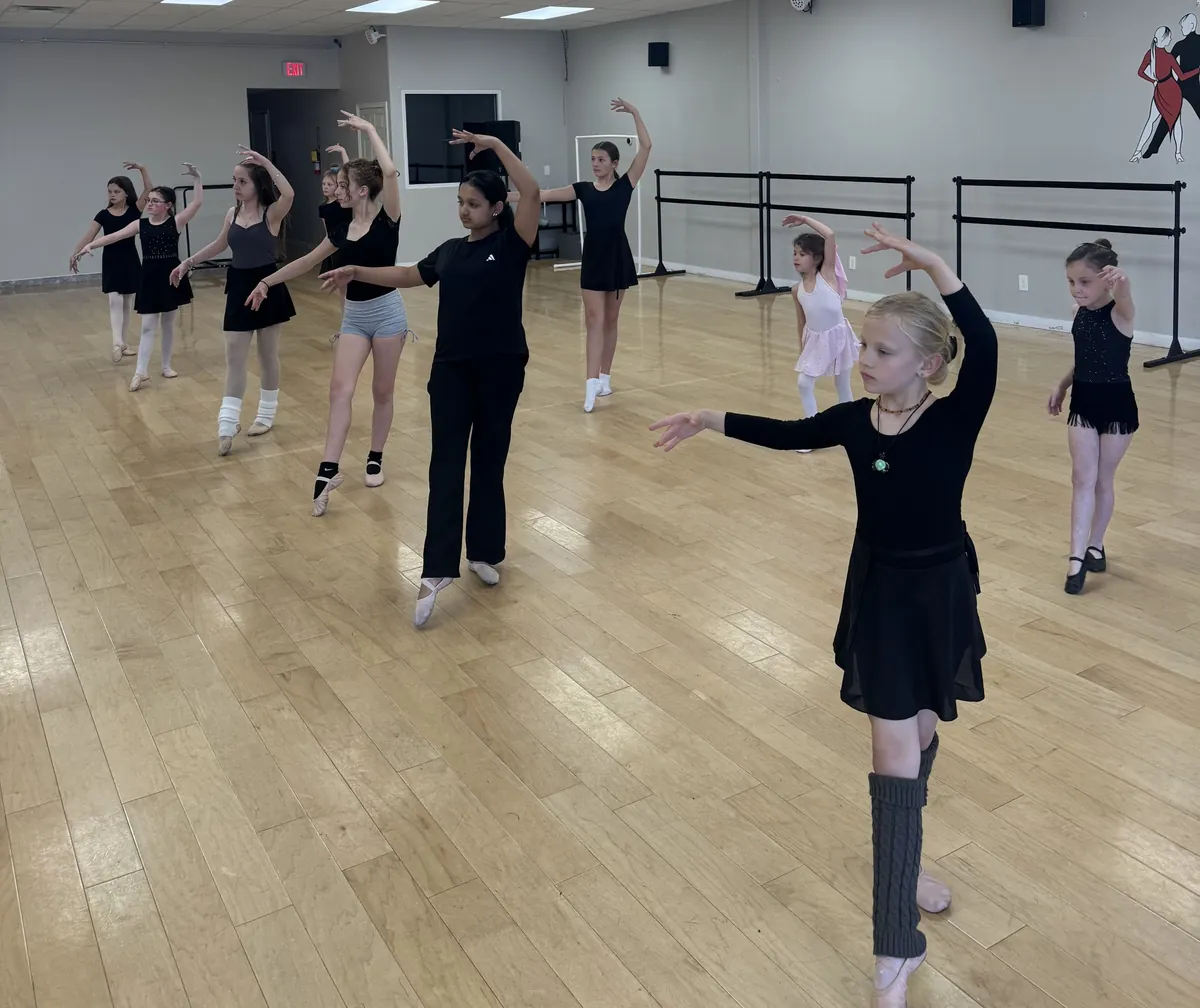 Pre-pointe ballet students practicing port de bras at Ladu Dance Studio in Sandy, Utah
