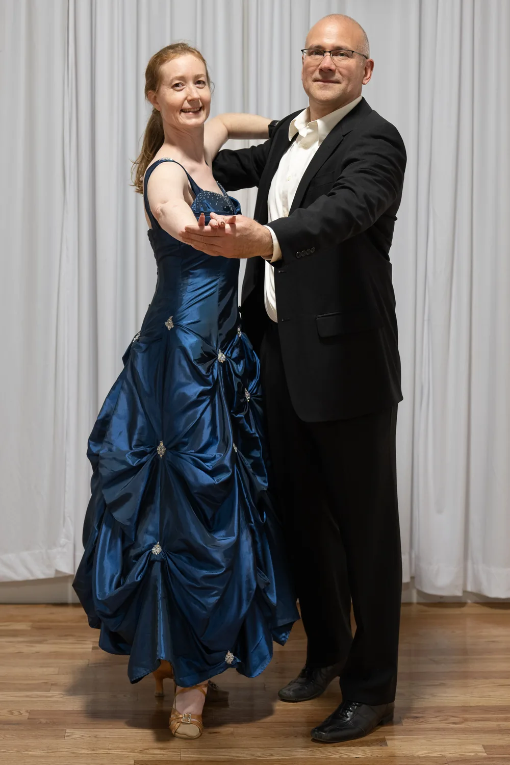 Adult couple in a private ballroom lesson