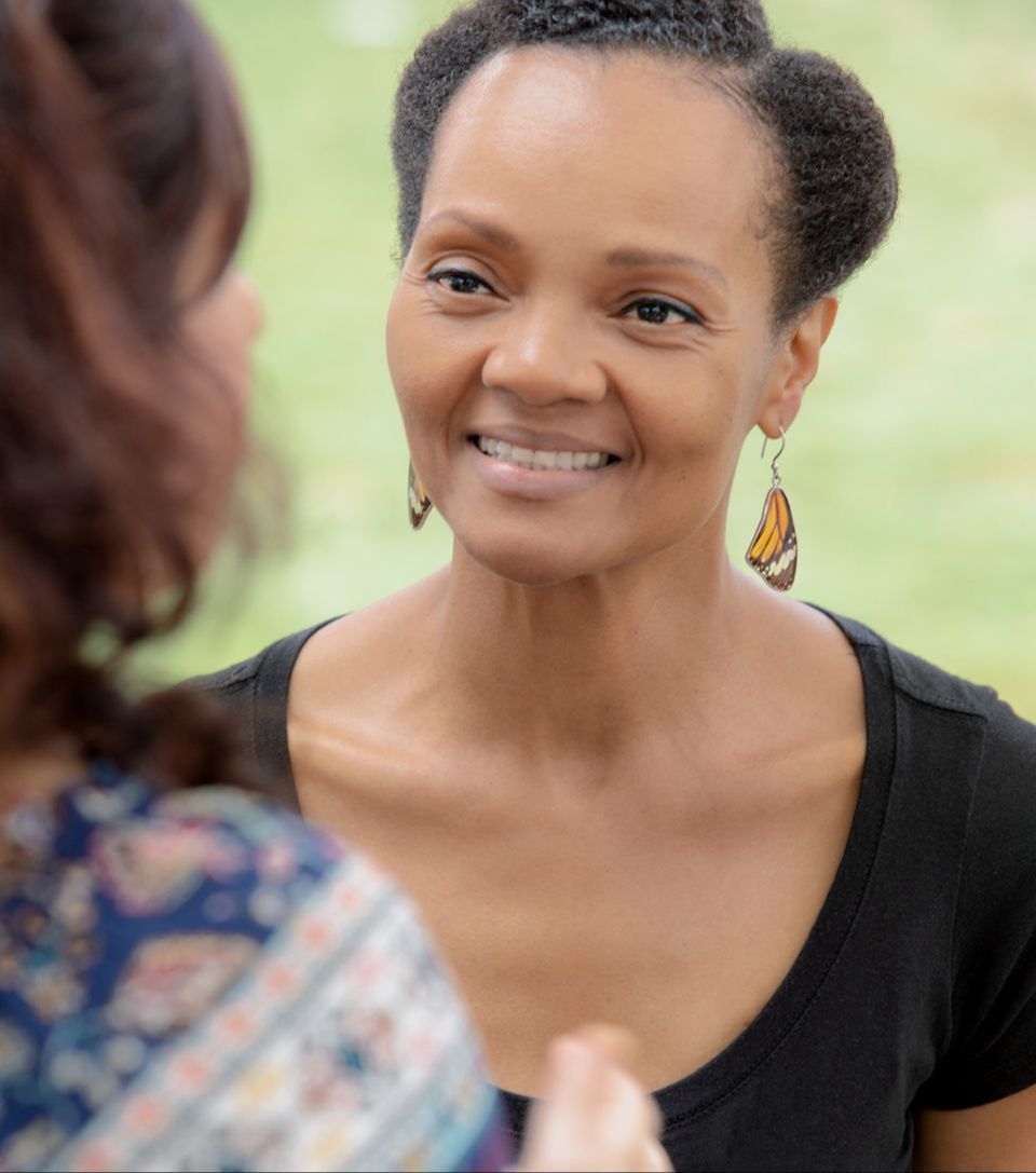Dr. Diedra smiling at a client