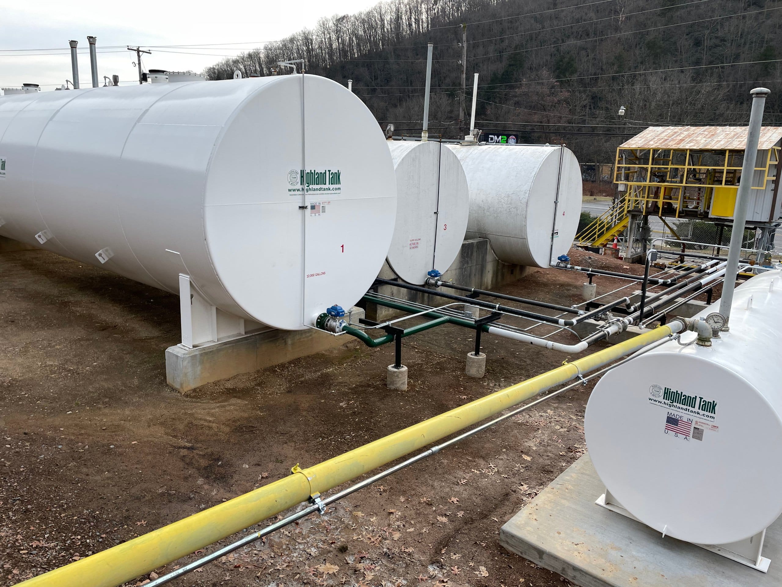 Tank farm containment area before liner installation, bare earth surface