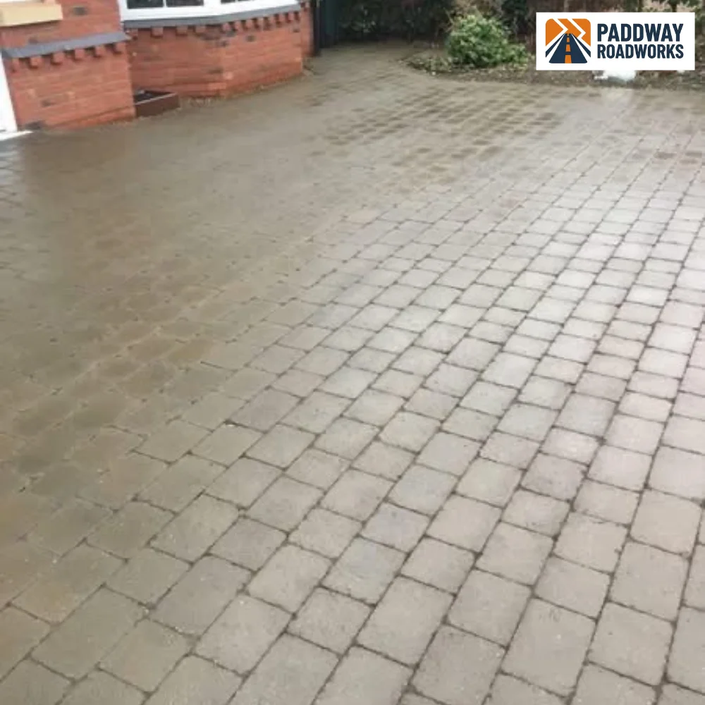 AFTER — same block paving fully pressure-washed, wet and clean.