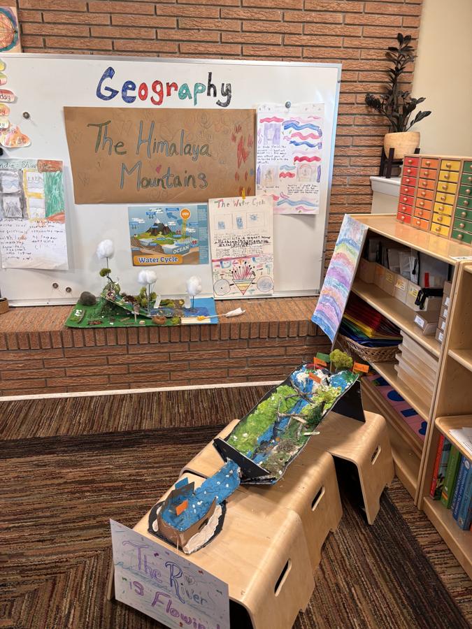 A geography display with student projects about mountains and rivers