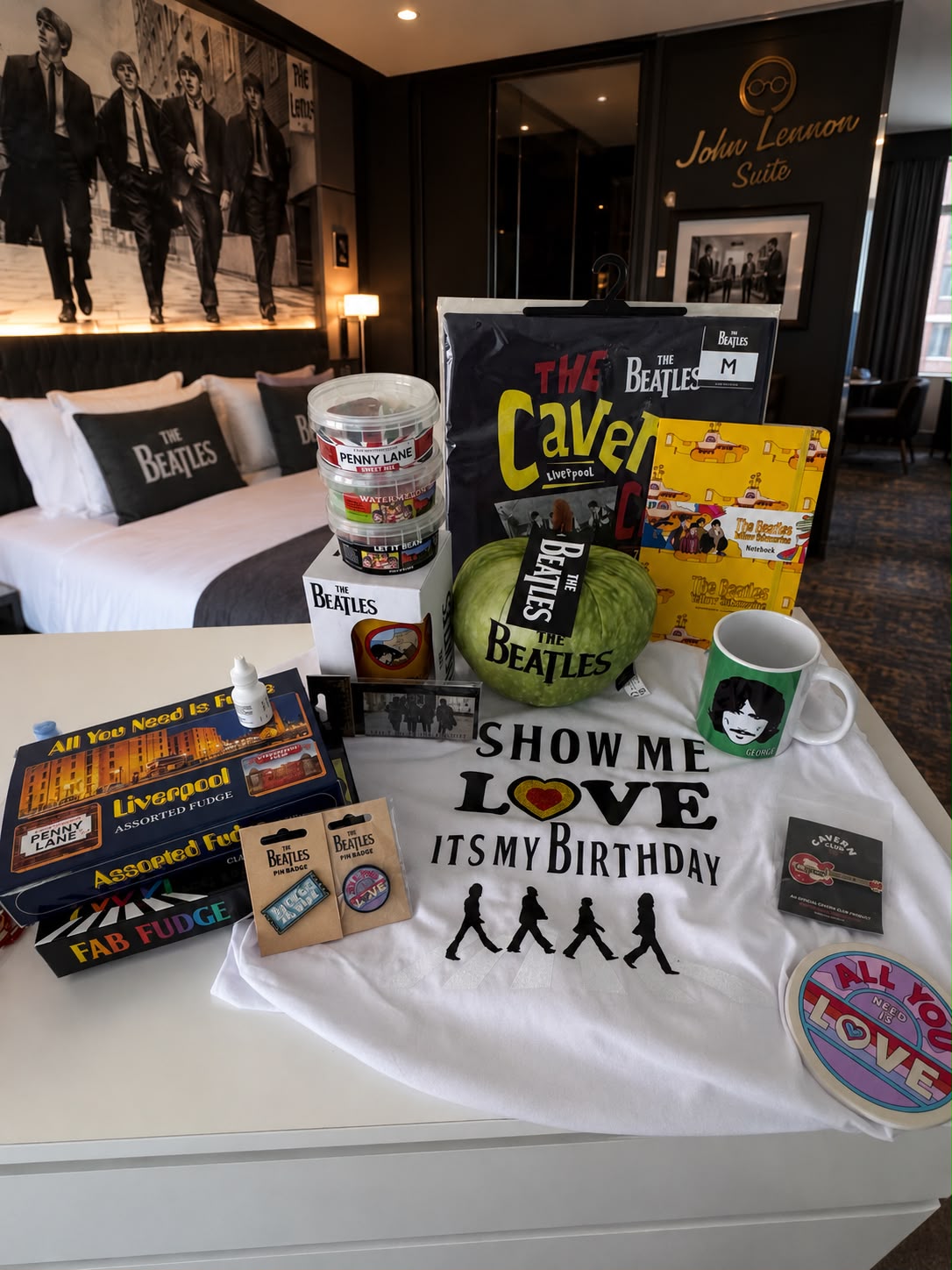 Beatles-themed hotel room with birthday gifts and memorabilia, reflecting music, memory and a personal weekend in Liverpool.