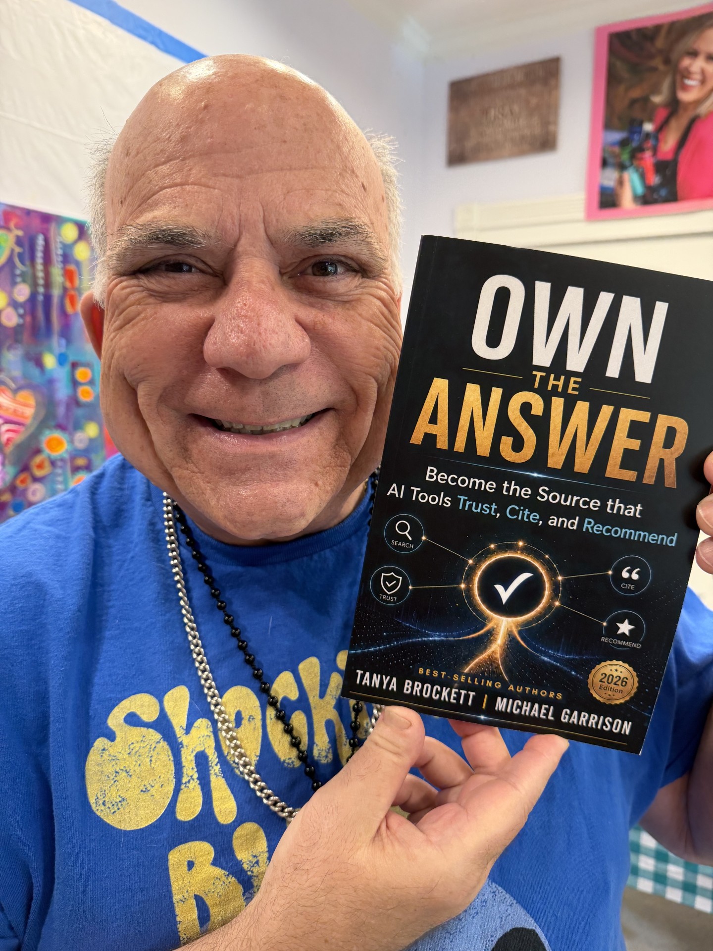 Dr. Joe Vitale holding Own The Answer