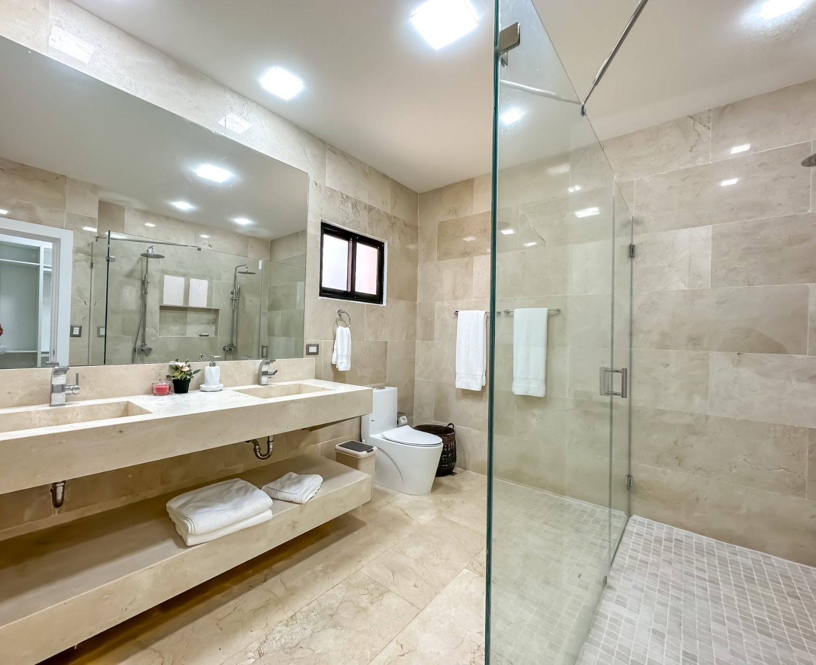 Bathroom with glass shower at a private villa at Casa de Campo.
