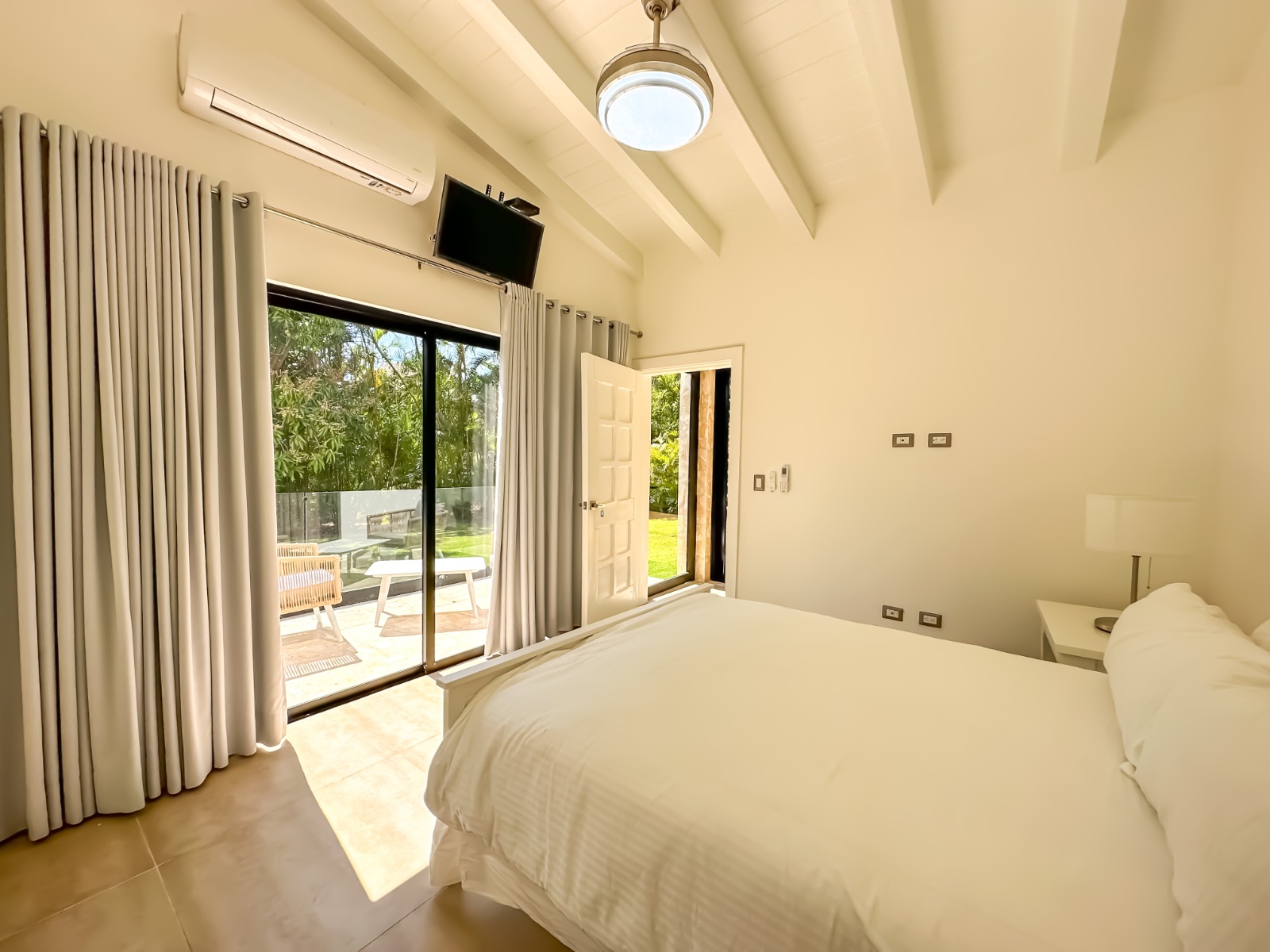 Bedroom with pool view at a private villa at Casa de Campo.
