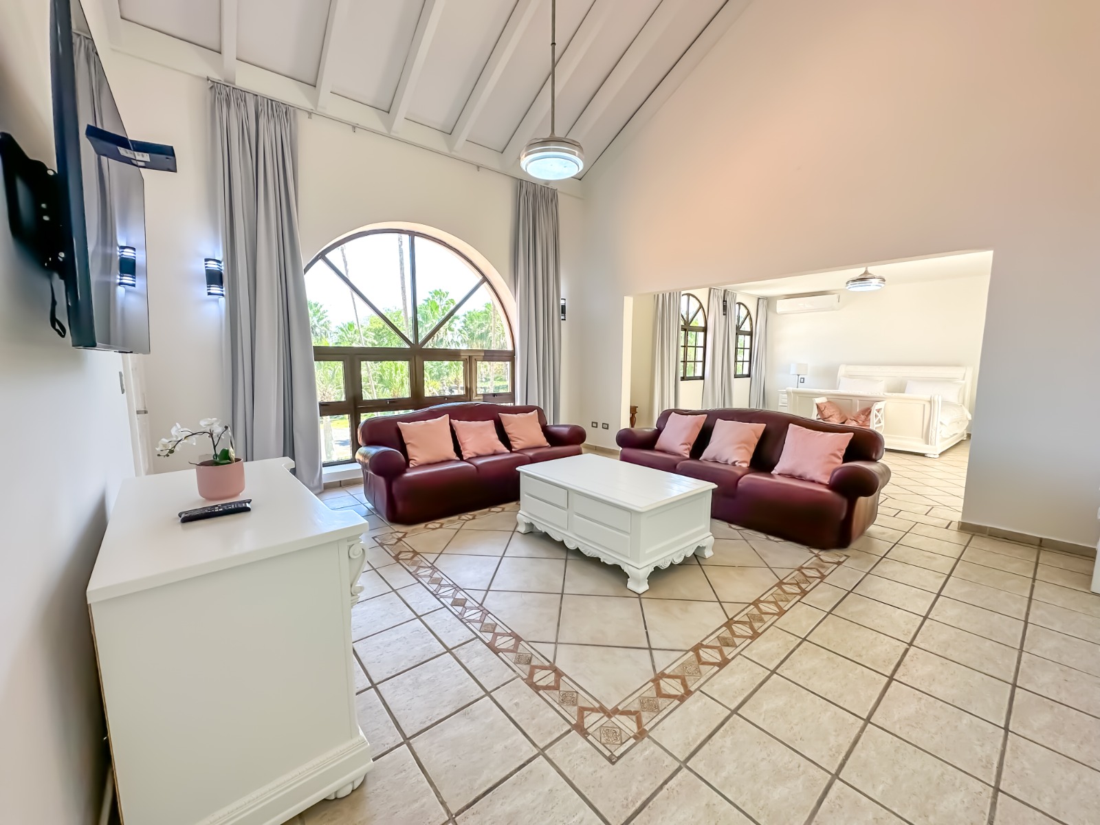 Lounge with red seating at a private villa at Casa de Campo.