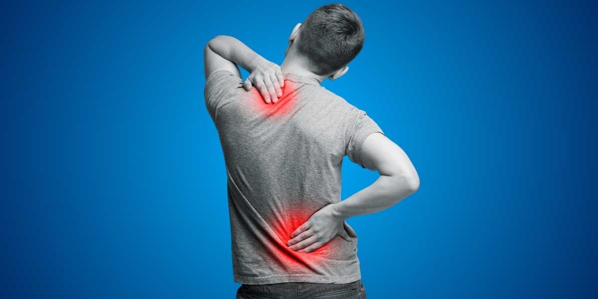 Back view of a person showing red pressure-point marks across the shoulders and lower back, illustrating where a mattress needs to absorb pressure
