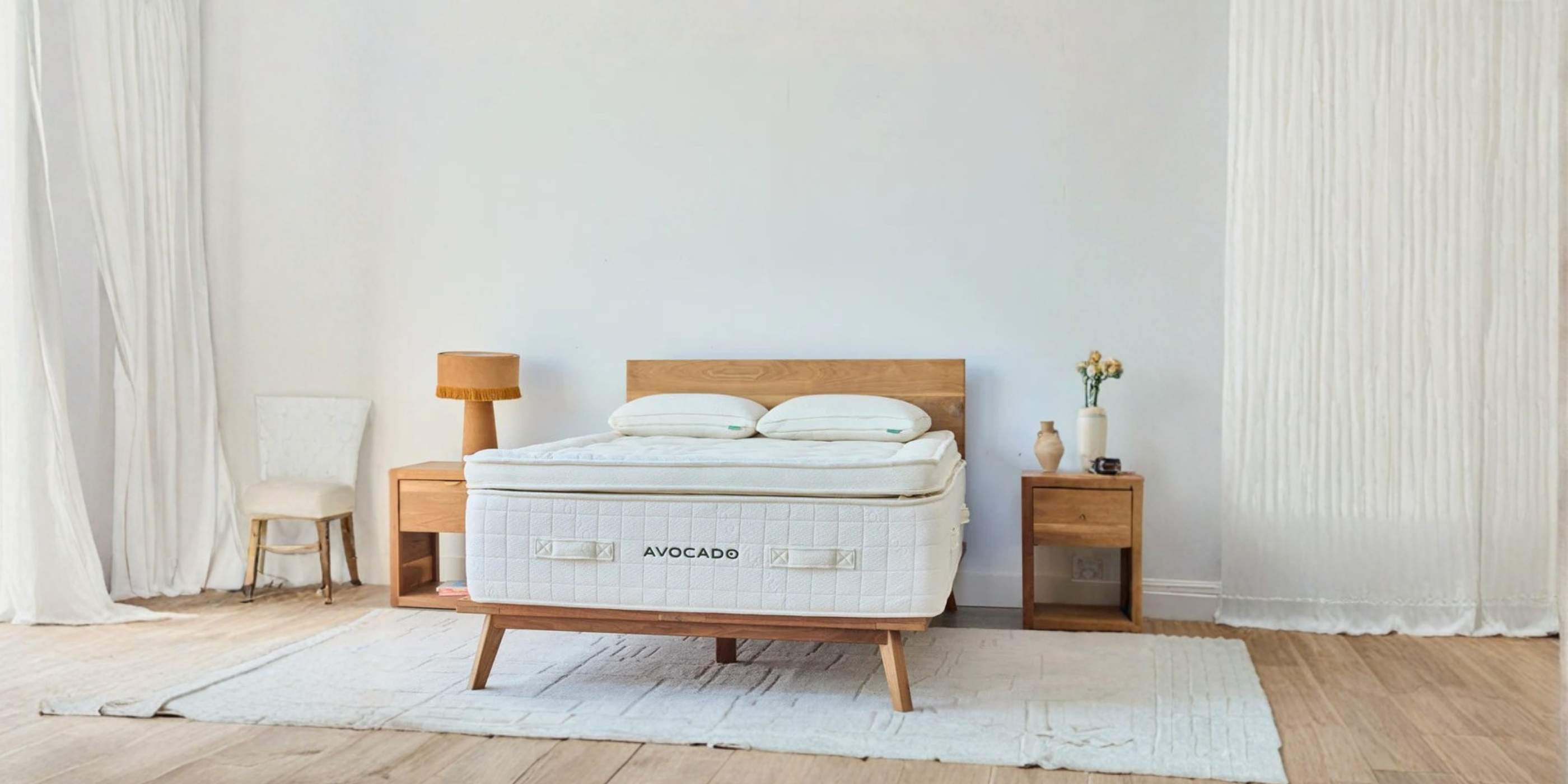 Avocado certified organic mattress styled in a modern bedroom