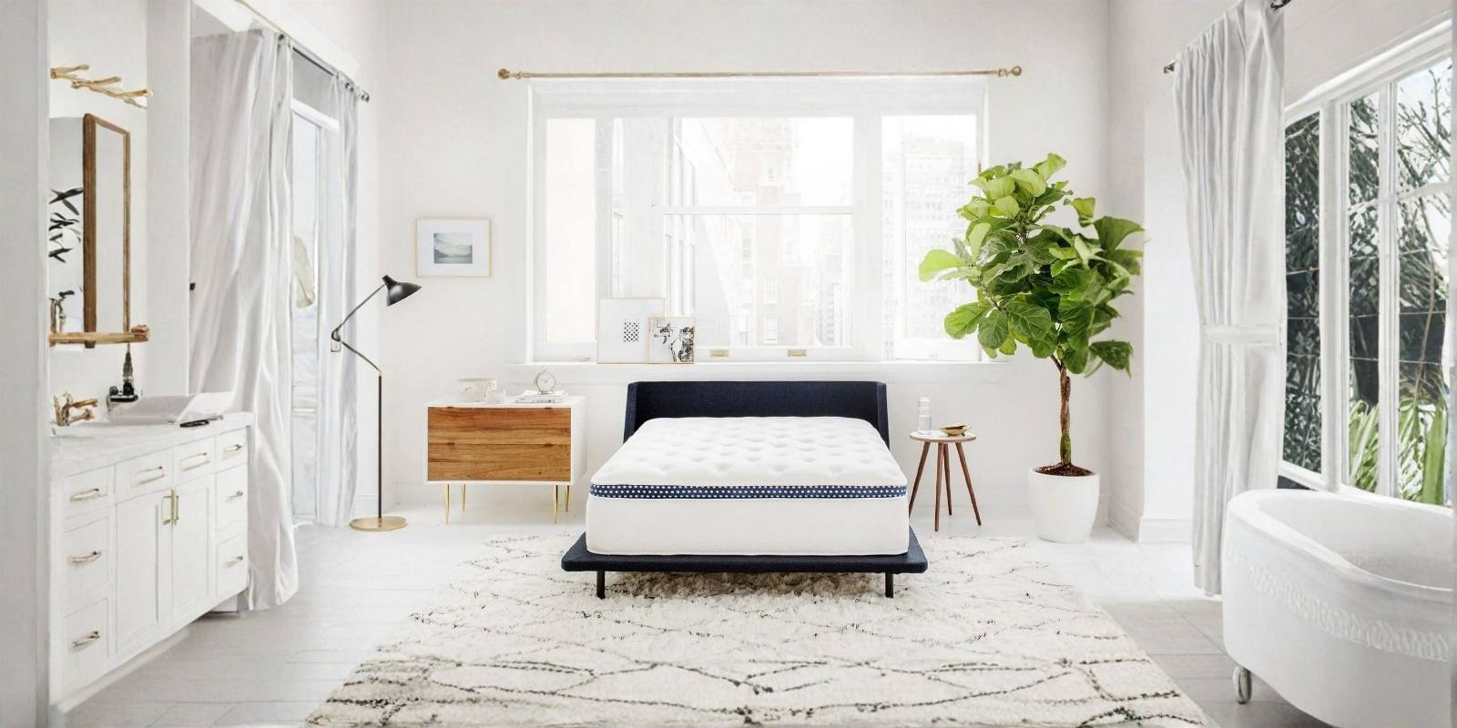The WinkBed hybrid mattress styled in a modern bedroom at Mattress Lux in Kennesaw, GA