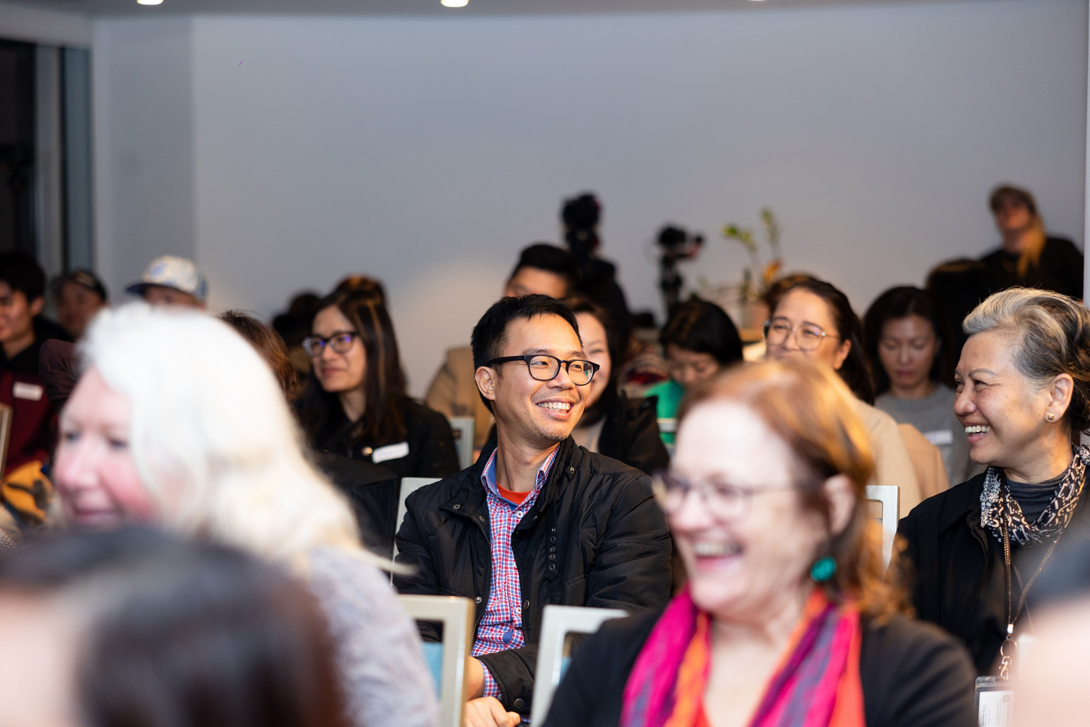 Audience laughing at Sip & Switch
