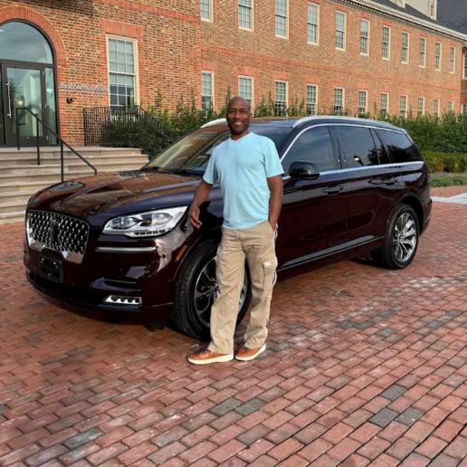 Timothy Bishop with his Lincoln Aviator