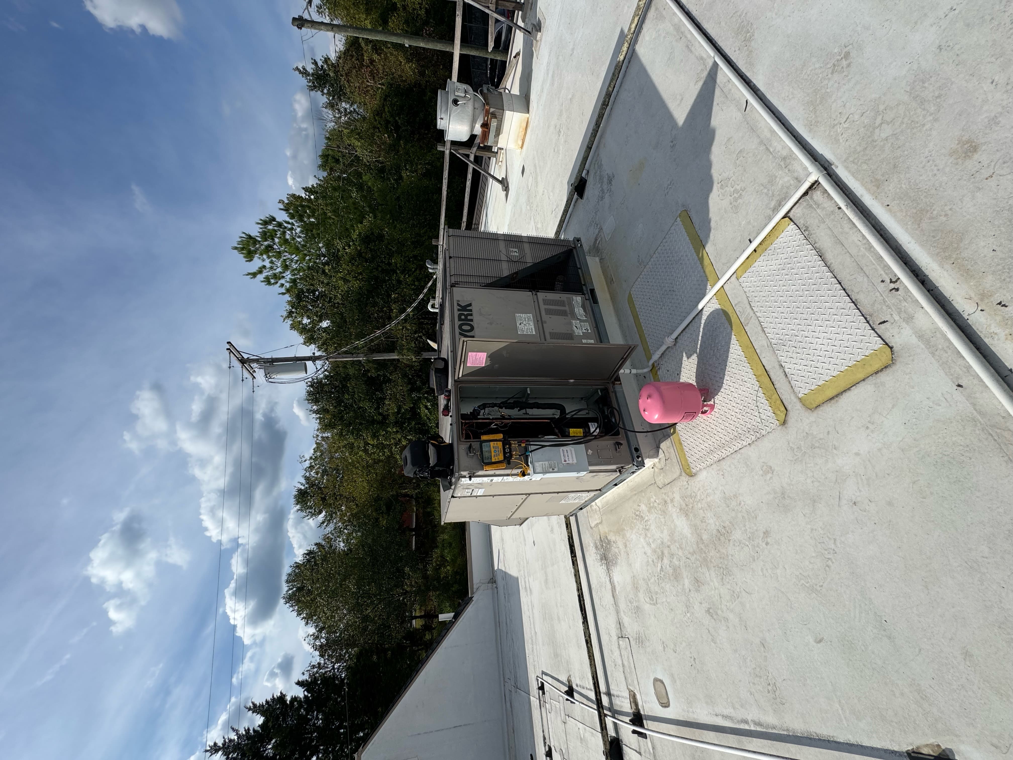 HVAC equipment lifted into place during system installation