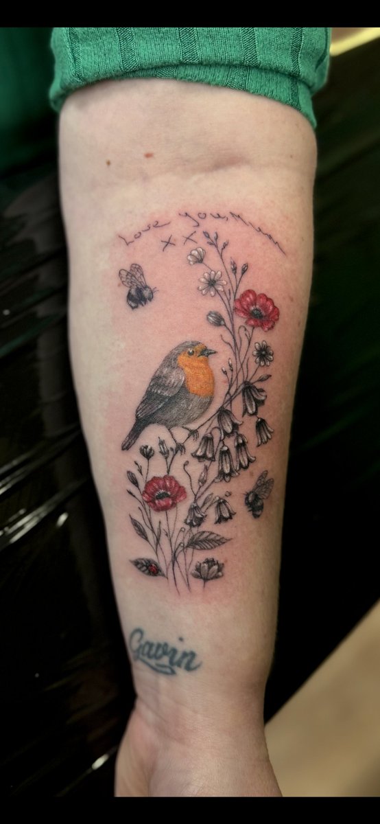Illustrative robin and florals tattoo by Aidin Chimney