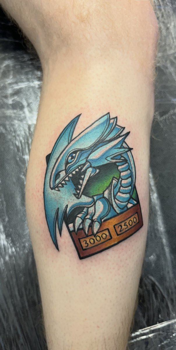 Yu-Gi-Oh dragon illustrative tattoo by Danny Woods, fine line Manchester