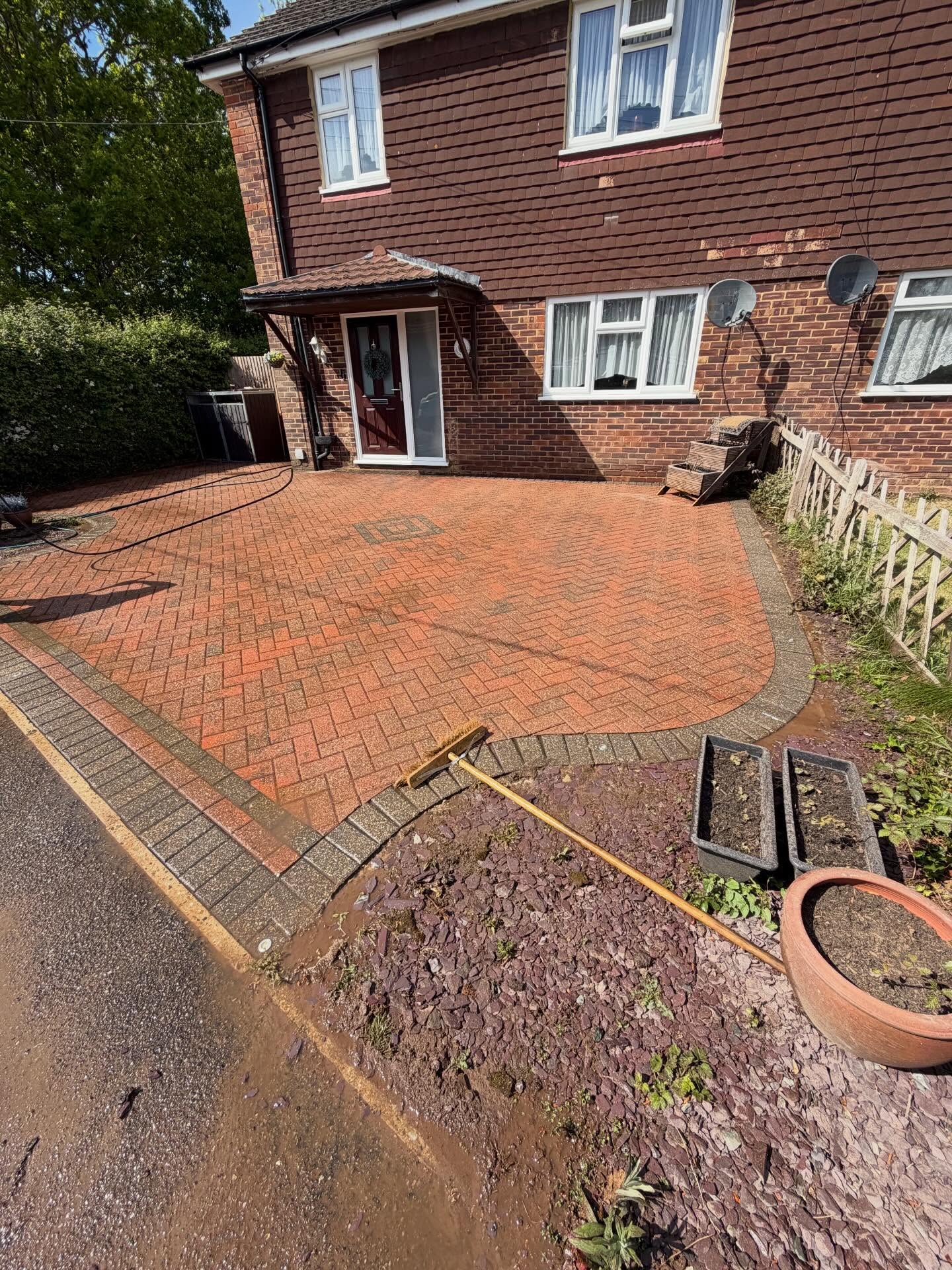 Driveway after professional pressure washing completed by Weeks Exterior Cleaning in Hastings