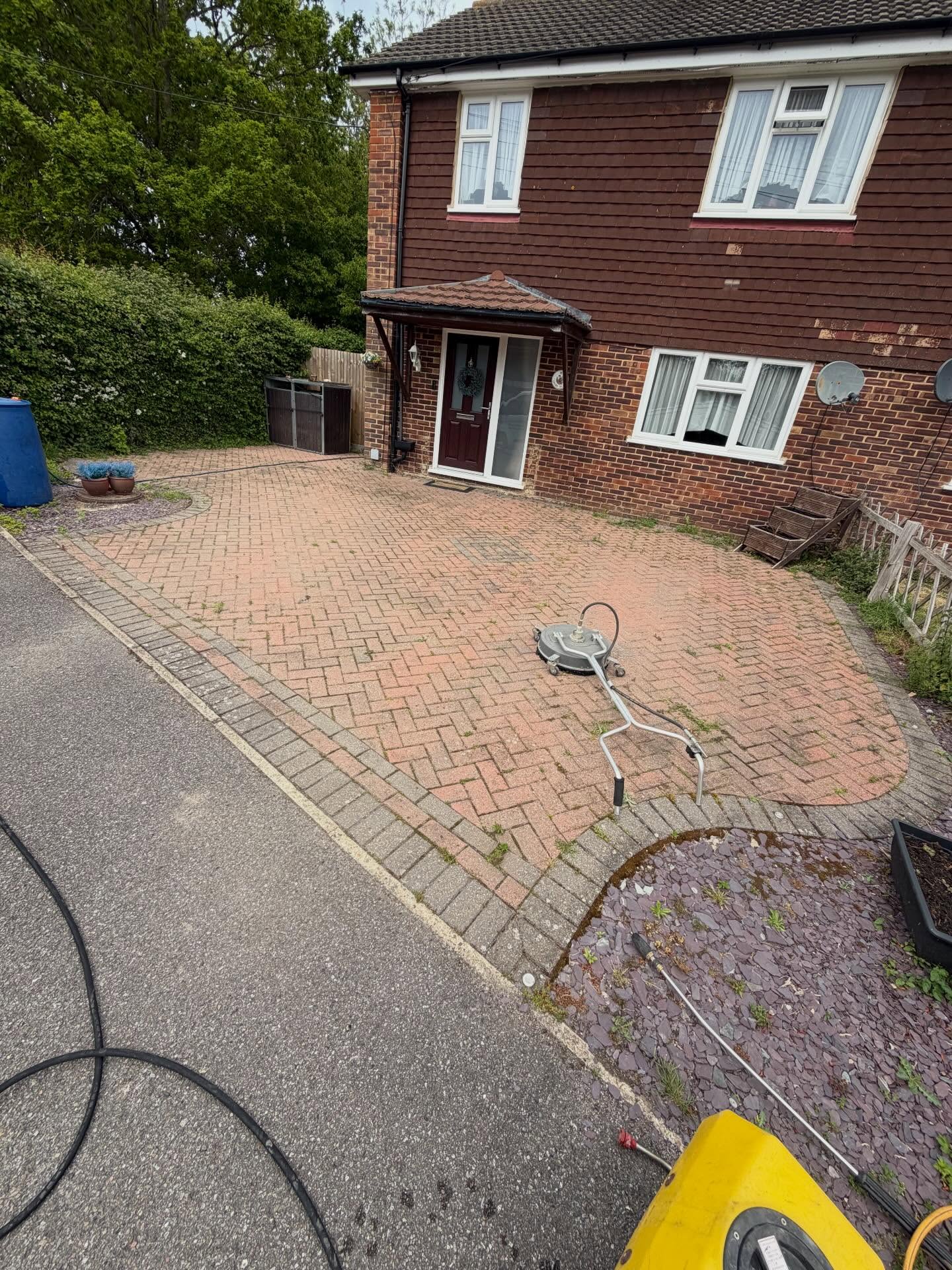 Driveway before pressure washing in Hastings by Weeks Exterior Cleaning