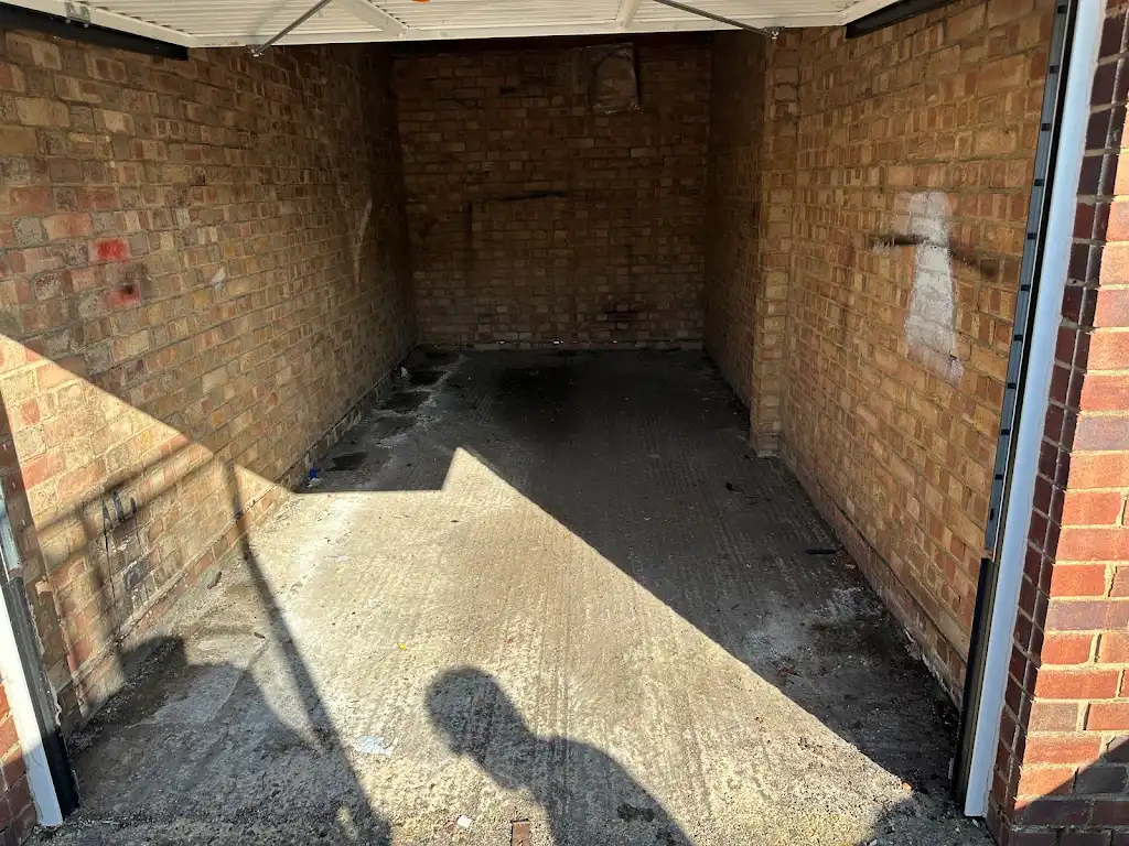 Empty garage after professional rubbish removal and garage clearance by Recycle DNC Ltd