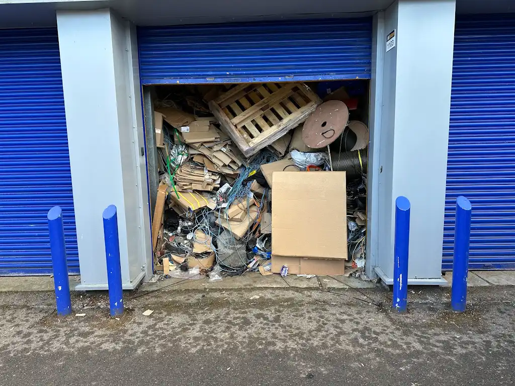 Messy garage before professional rubbish clearance in Harefield by Recycle DNC Ltd