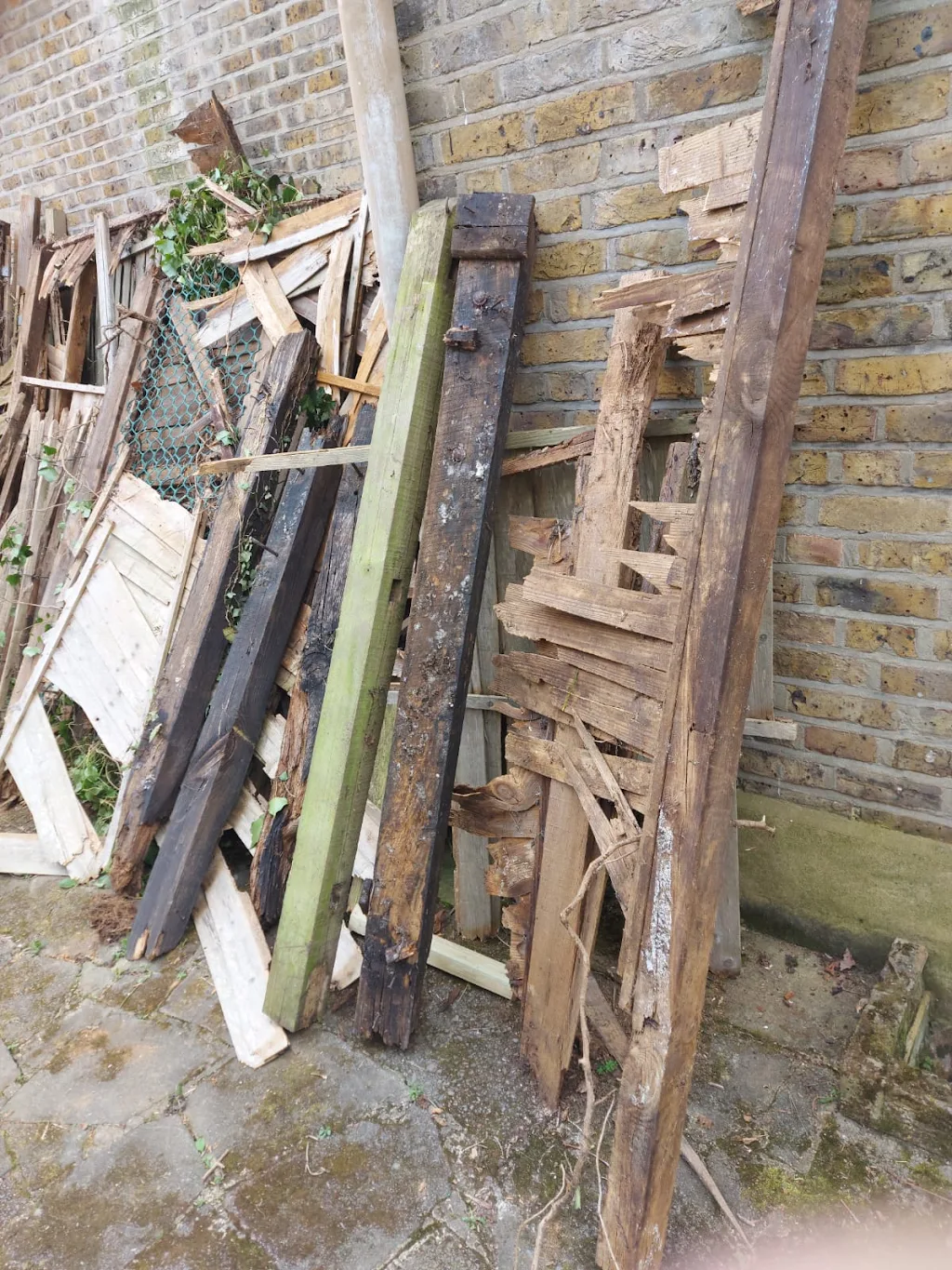 Removed fencing and unwanted timber before professional outdoor waste clearance by Recycle DNC Ltd