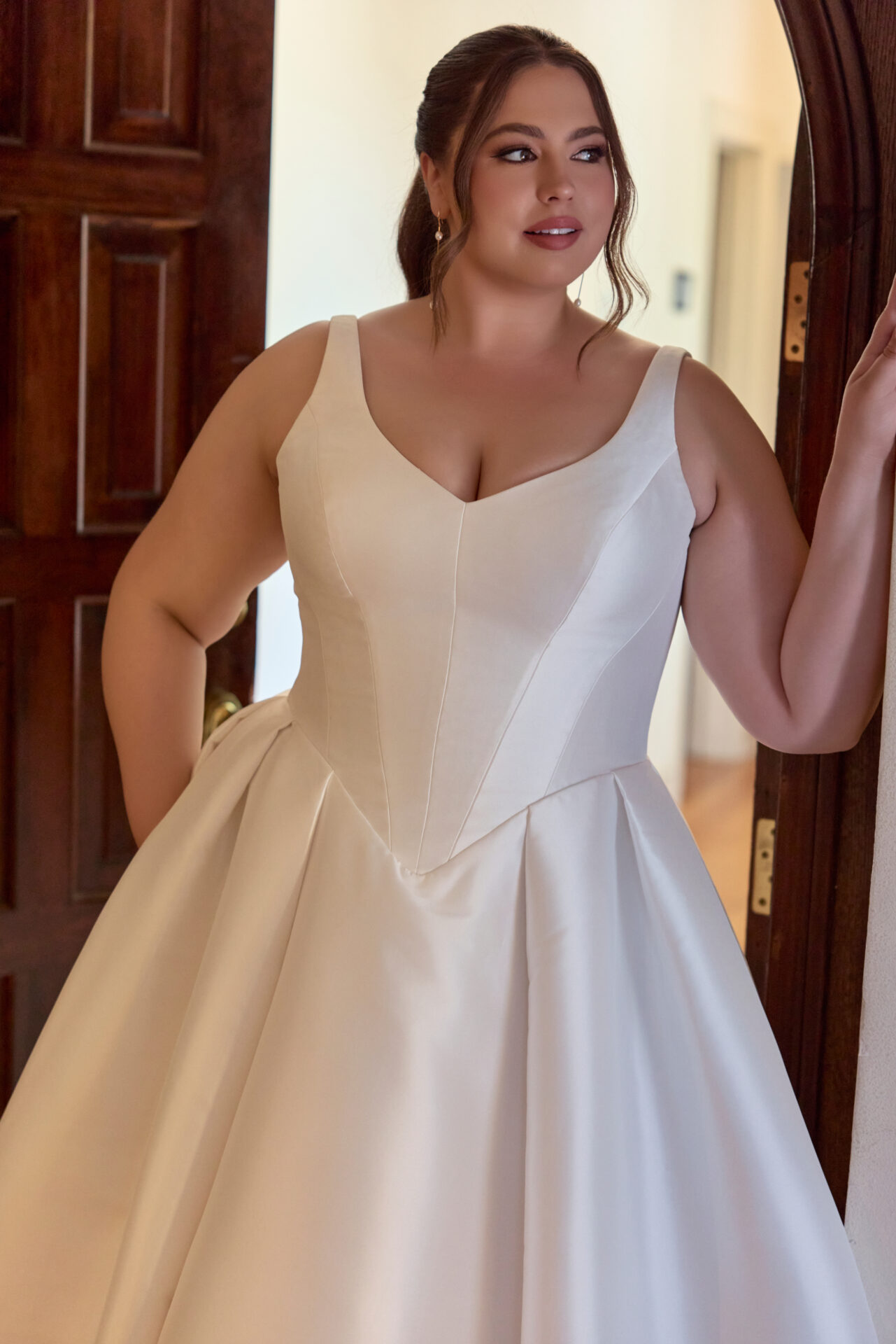 Plus size bride in a gorgeous bridal gown at Boulevard Bride Lake St. Louis