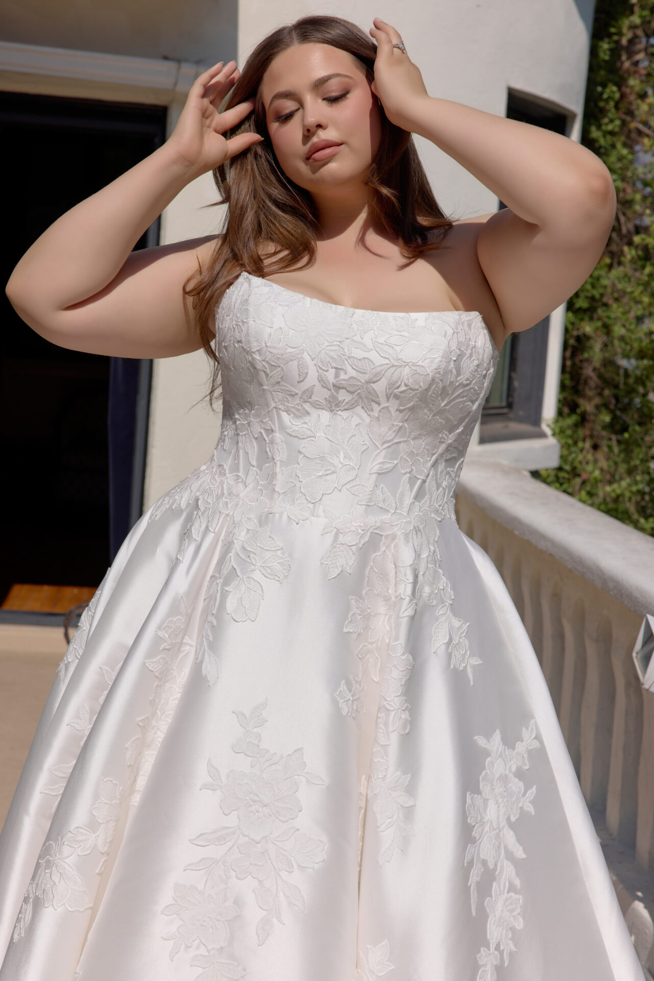 Plus size bride in a stunning bridal gown at Boulevard Bride boutique