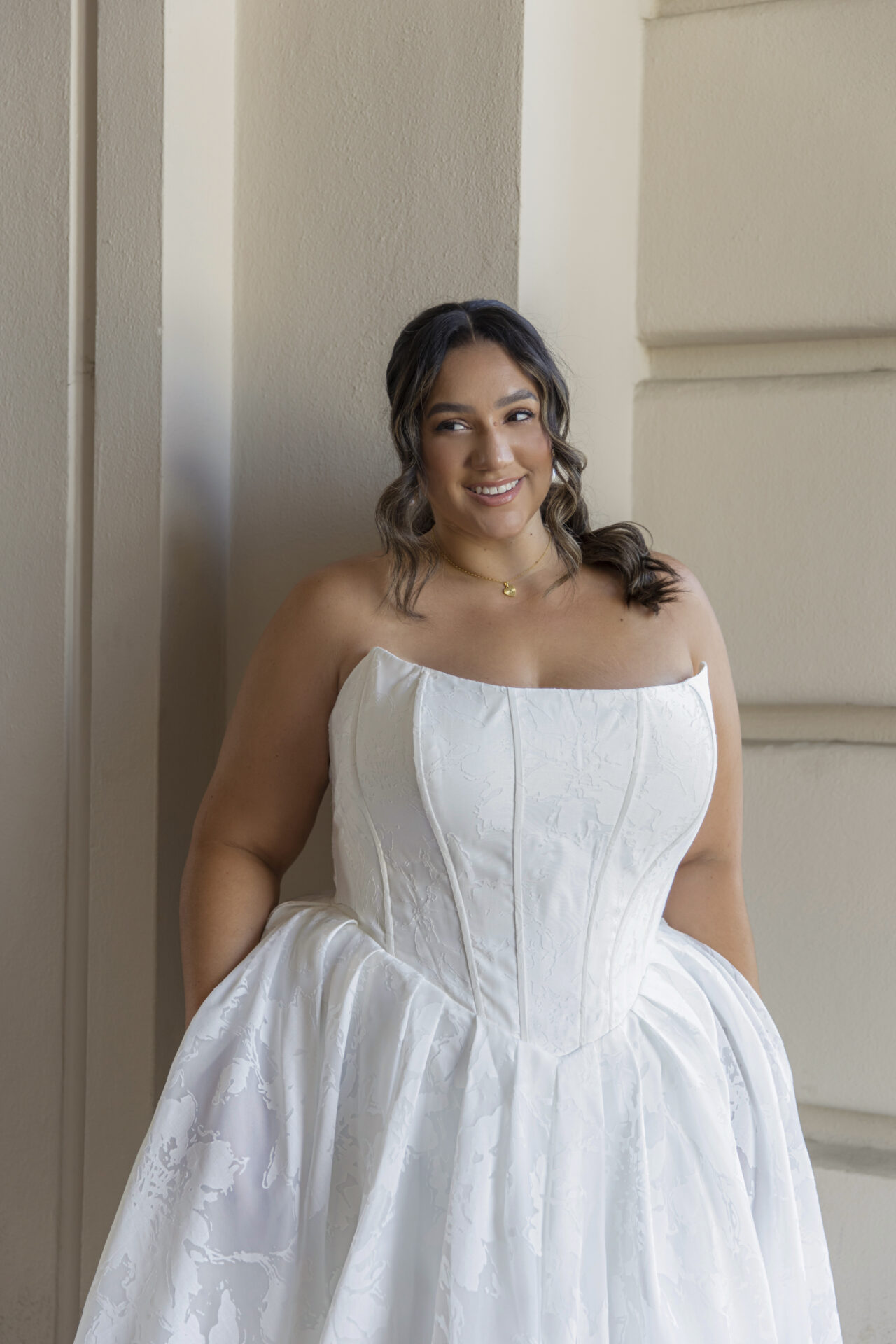 Plus size bride wearing an elegant wedding dress at Boulevard Bride