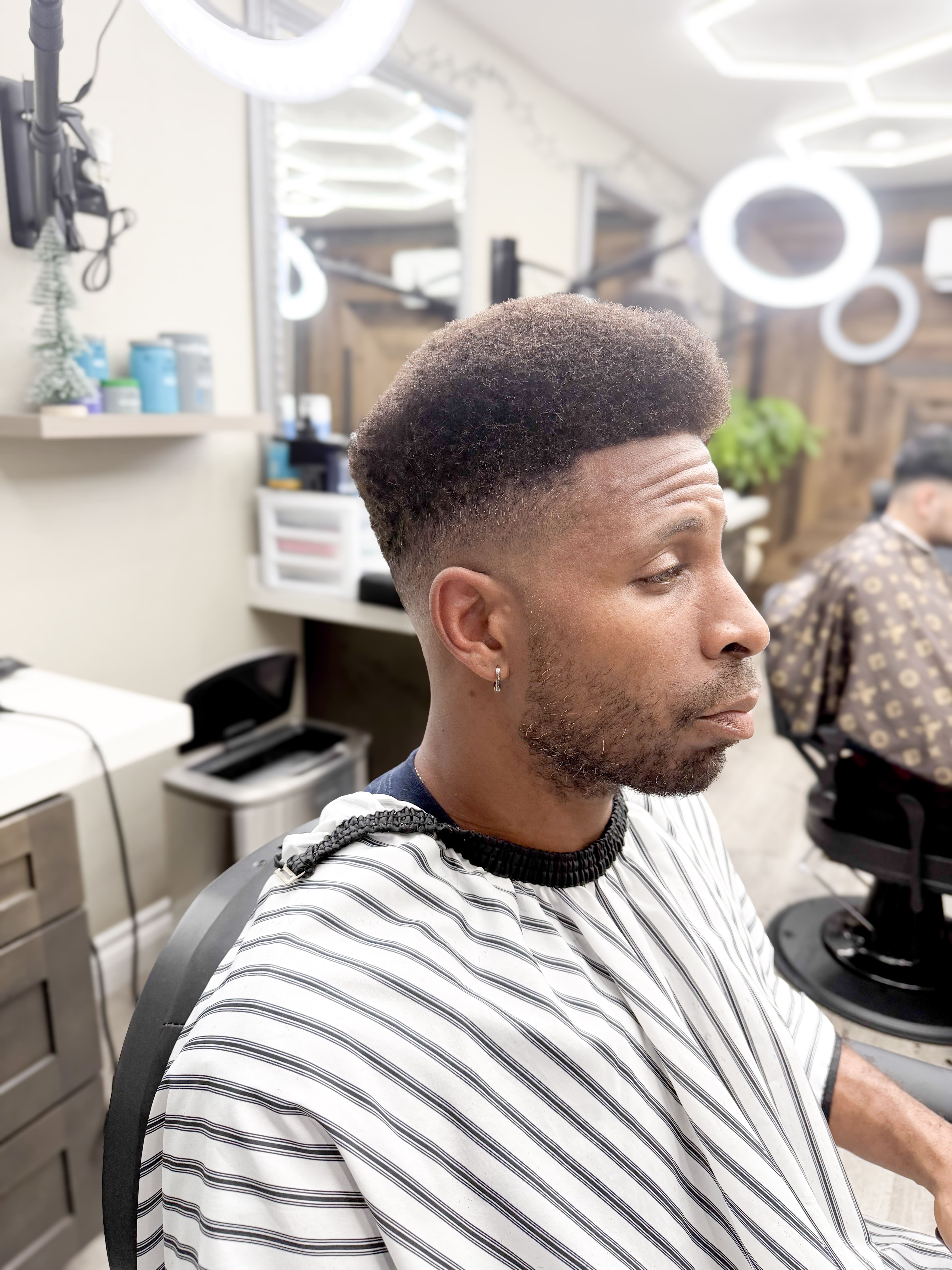 Barber at work at Alexa's Barbershop Eastvale