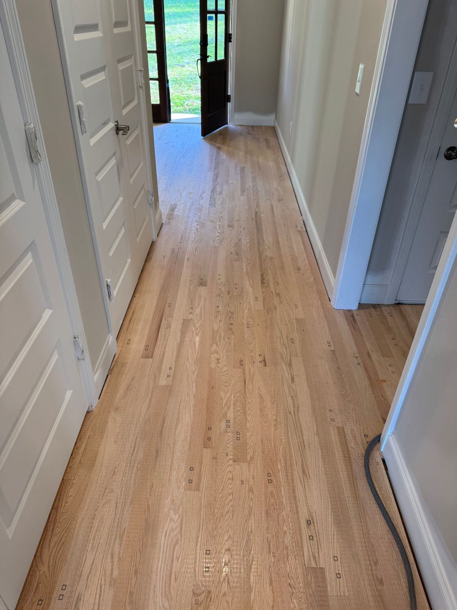 fully installed hardwood flooring ready to be sanded and finished