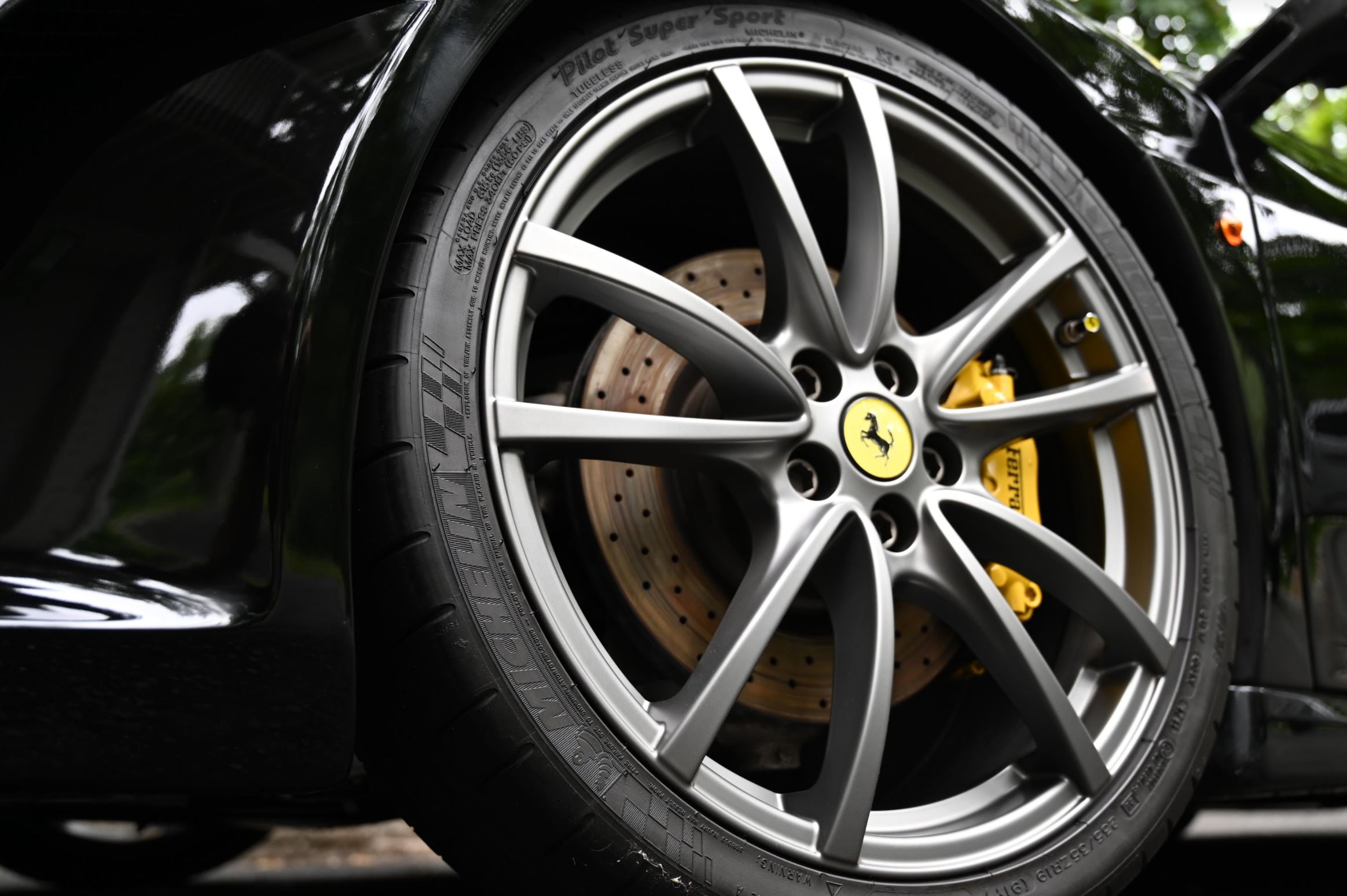 Ferrari wheel and carbon ceramic brake detail