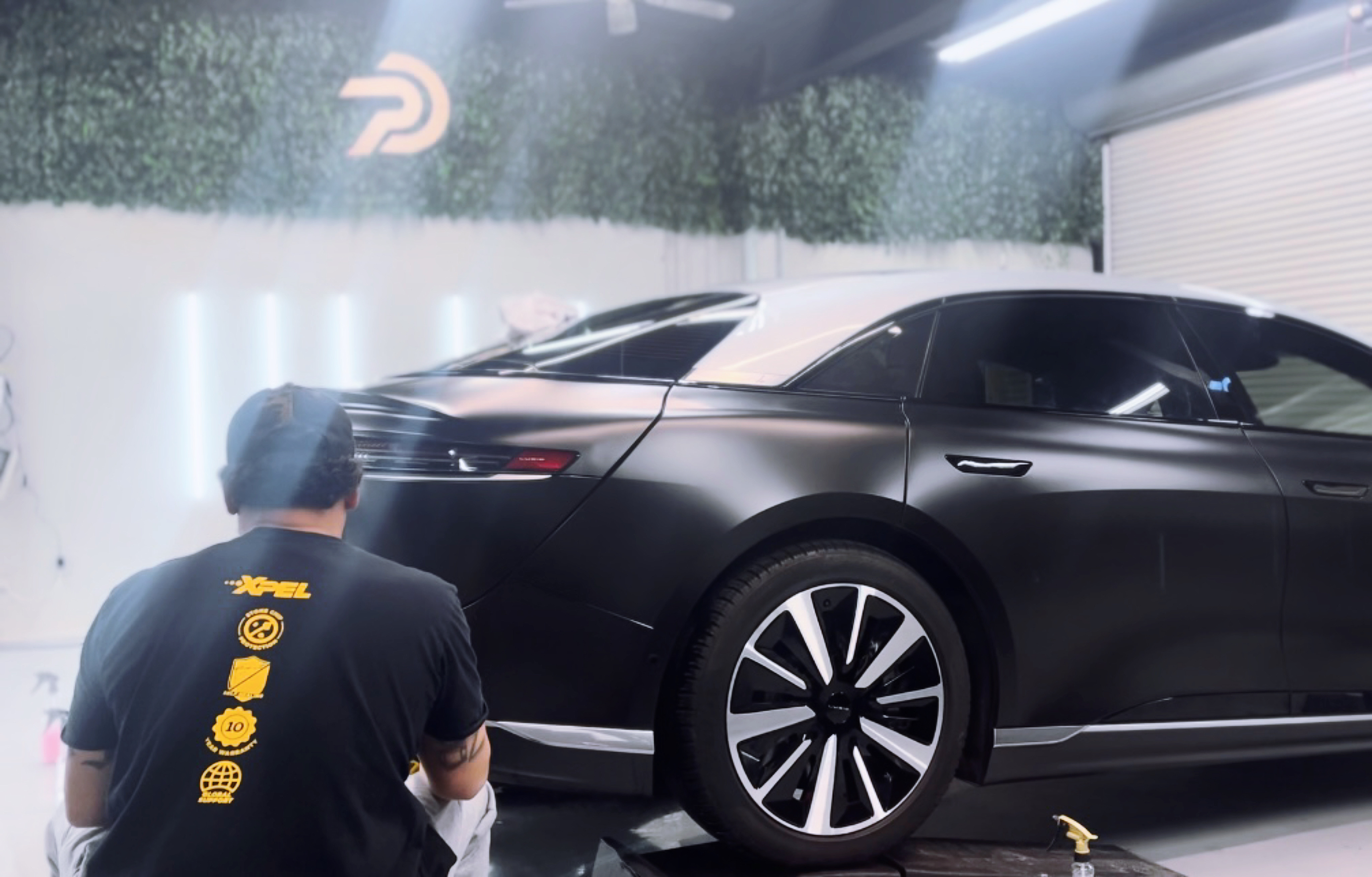 Satin matte stealth paint protection film on a Lucid Air