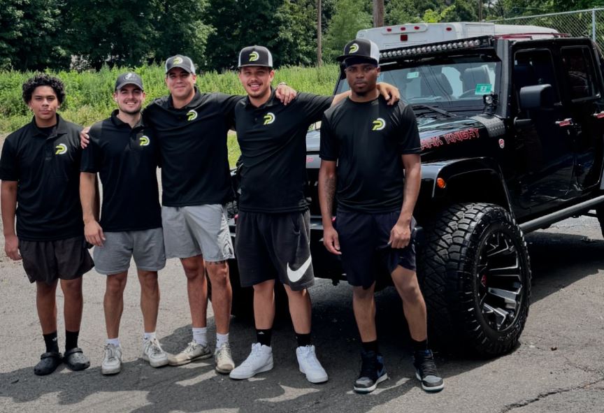 The certified Premier Detailing NJ team outside the Scotch Plains shop