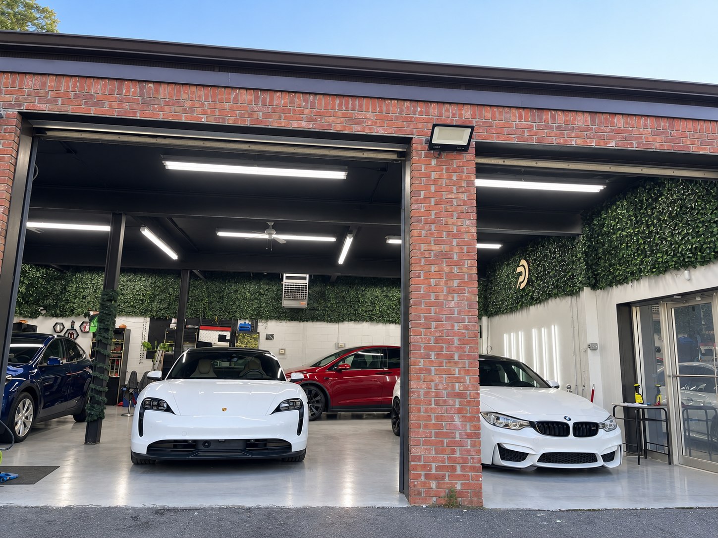 The Premier Detailing NJ shop in Scotch Plains with vehicles in both bays