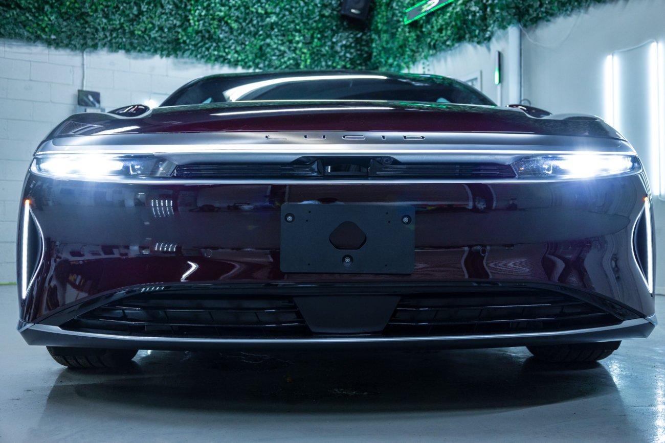 Front end of a vehicle protected with windshield film