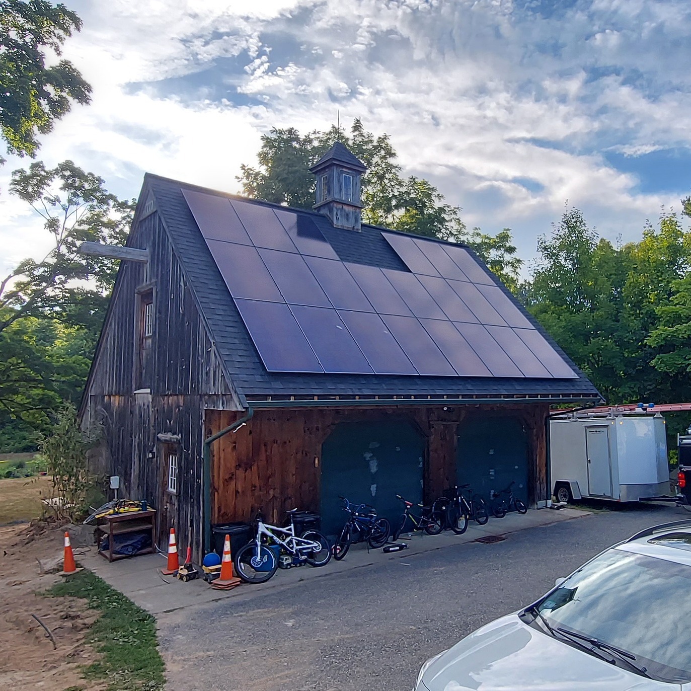 Same carriage house roof after Solar Dave installed black-on-black solar panels